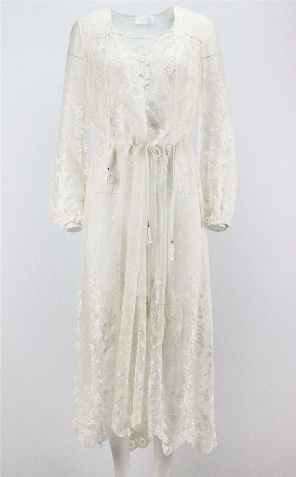 Zimmermann's Roza dress is delicately embroidered with a floral motif along the hem and bodice, this diaphanous style is crafted from silk-georgette and is detailed with tassel-trimmed laces at the neck.
Ivory silk-georgette.
Slips on.
100% Silk;