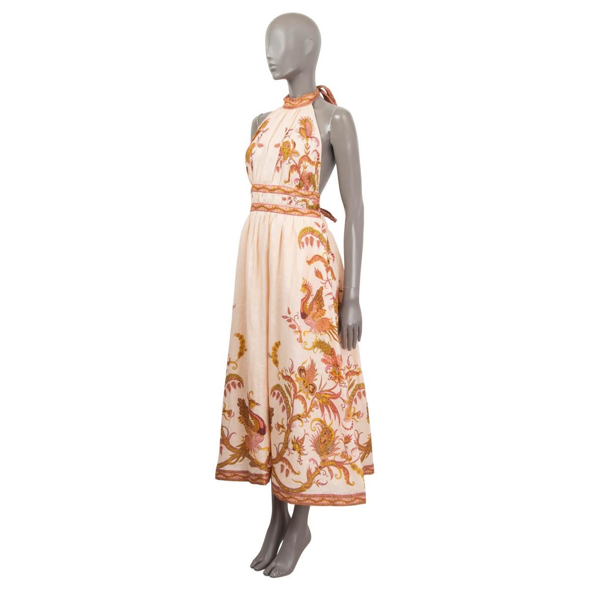 100% authentic Zimmermann Cassia halter bow midi dress in salmon linen (100%). Lined in salmon colored cotton (100%). Closes with a halter bow behind the neck and can be adjusted with a bow tie in the back. Features a stretchy waistband through the