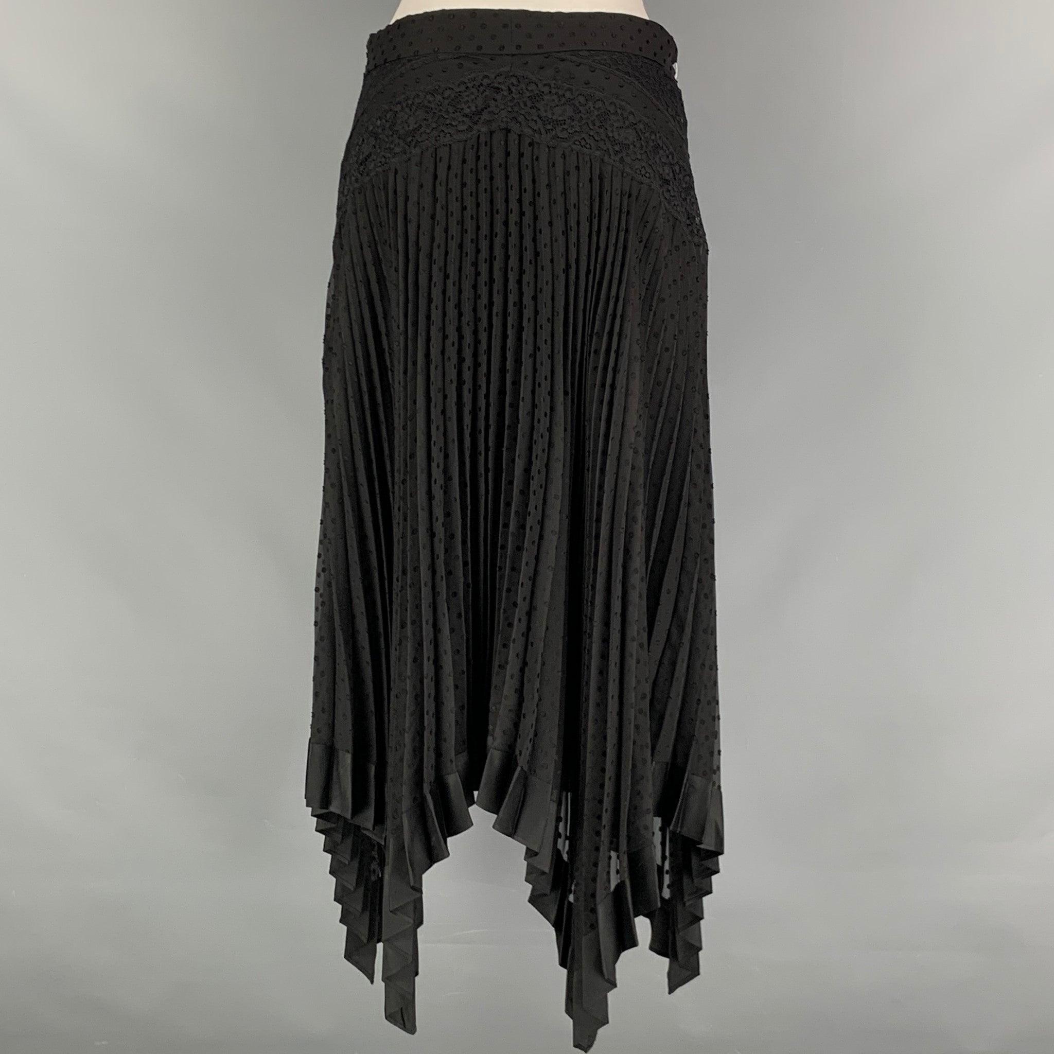 ZIMMERMANN skirt comes in a black viscose and polyester polka dot woven material features an A-line silhouette, asymmetrical pointed front, lace detail at waist and pleated style. Made in Italy.Excellent Pre-Owned Condition. 

Marked:   2