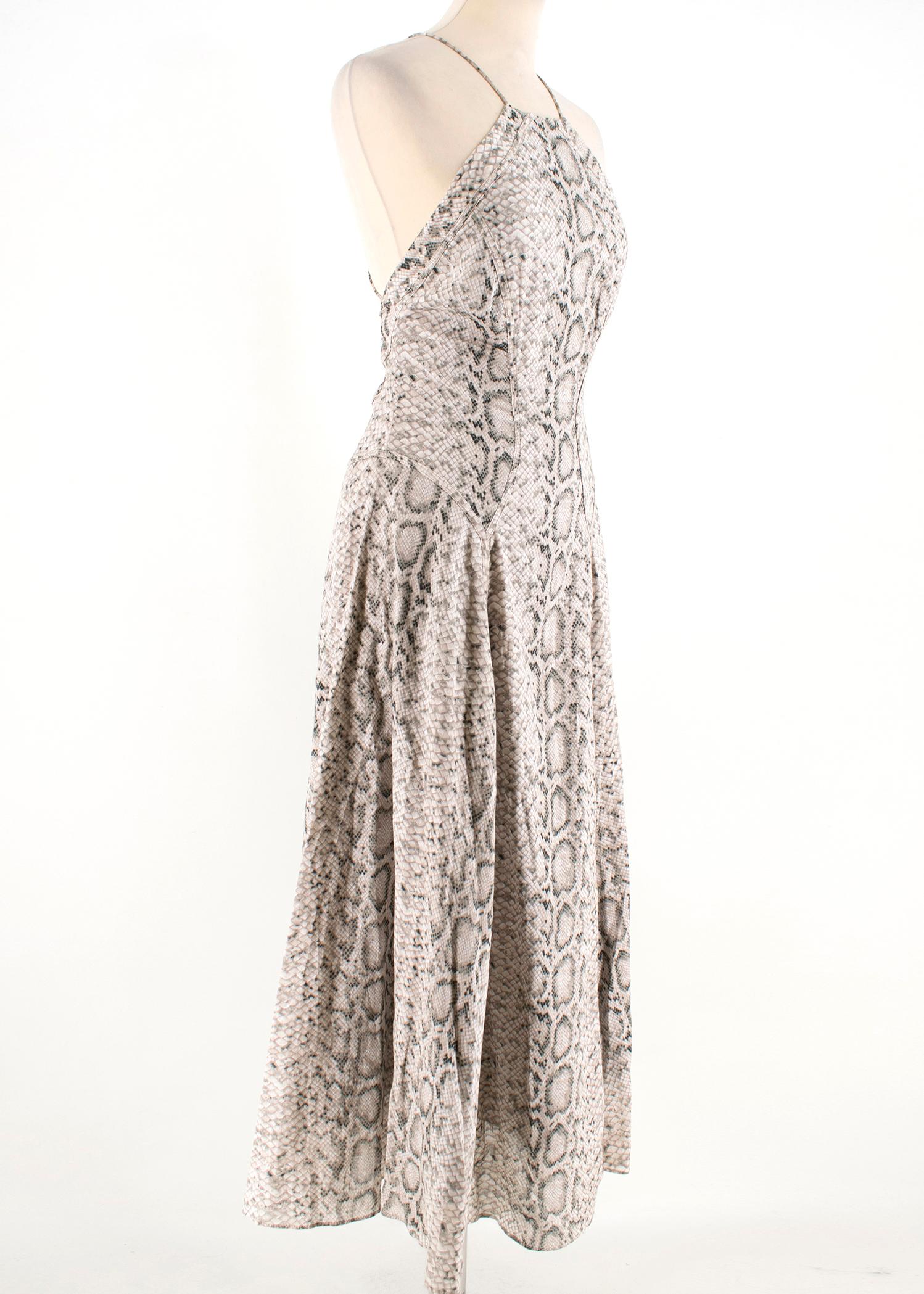 Zimmermann Snake print dress, perfect for the evening time or a hot summer day.

- Spaghetti string cross over dress
- Deep open back

Please note, these items are pre-owned and may show signs of being stored even when unworn and unused. This is