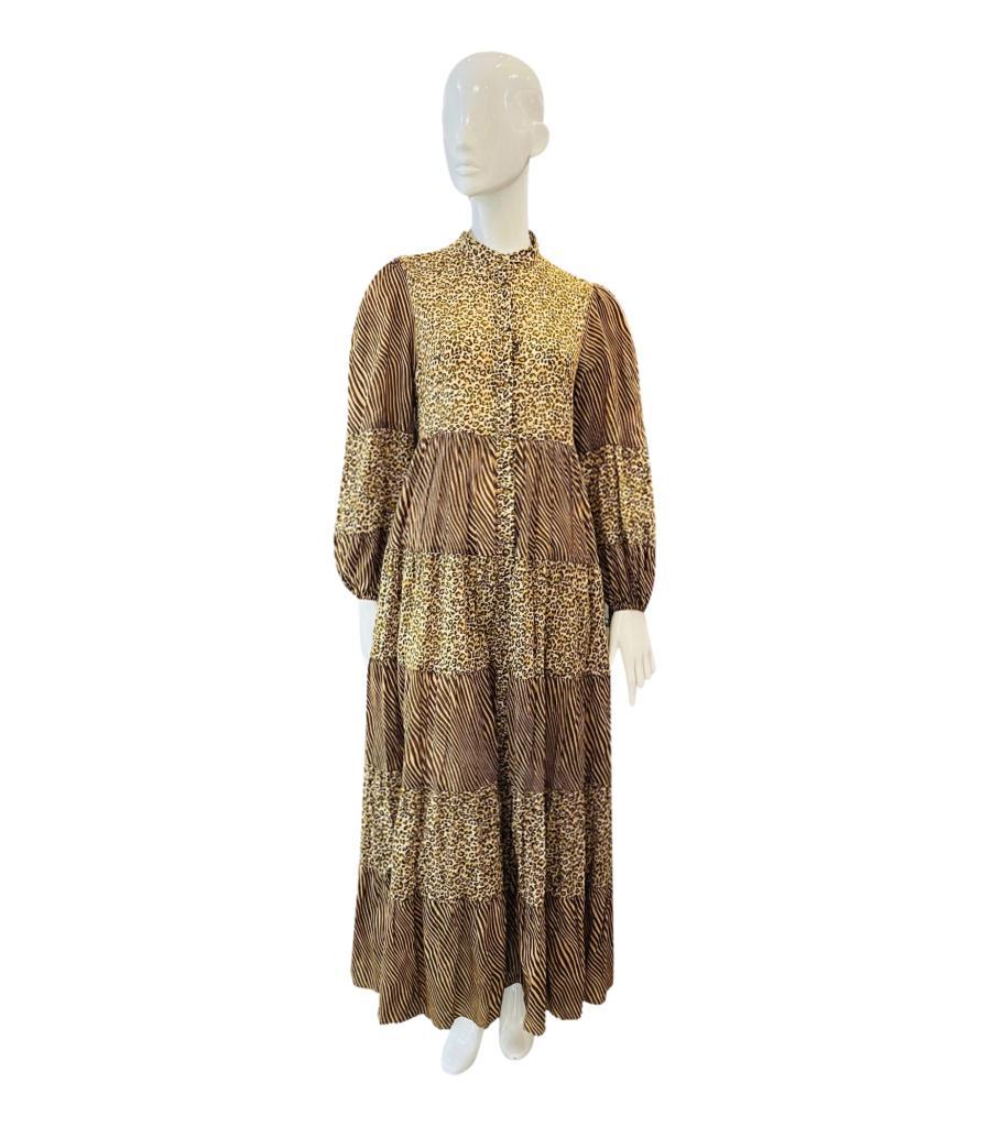 Zimmermann Tiered Cotton Dress
Brown maxi 'Empire' dress designed with all-over leopard and zebra print.
Featuring tiered silhouette, high collar, button closure and balloon sleeves with elasticated cuffs.
Size – 2 - M
Condition – Very