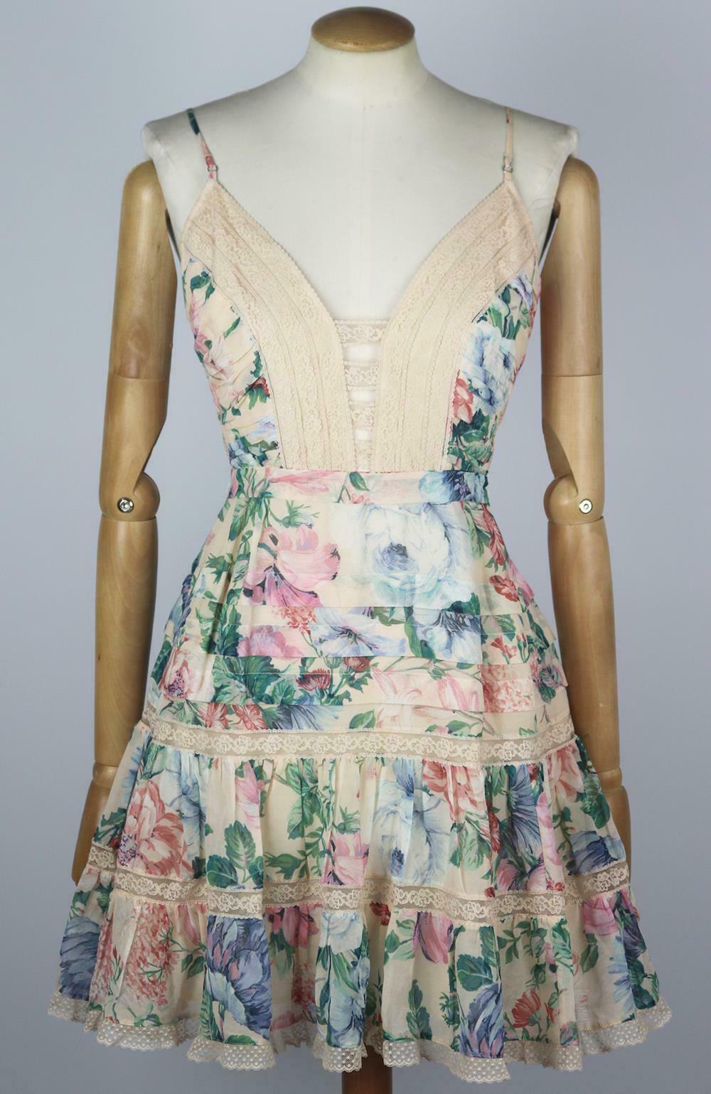 Zimmermann's feminine 'Verity' dress is made from lightweight cotton and silk-blend chiffon that's printed with vintage-inspired blooms, it has thin adjustable straps and delicate lace trims along the fitted bodice and flowy, tiered skirt, the