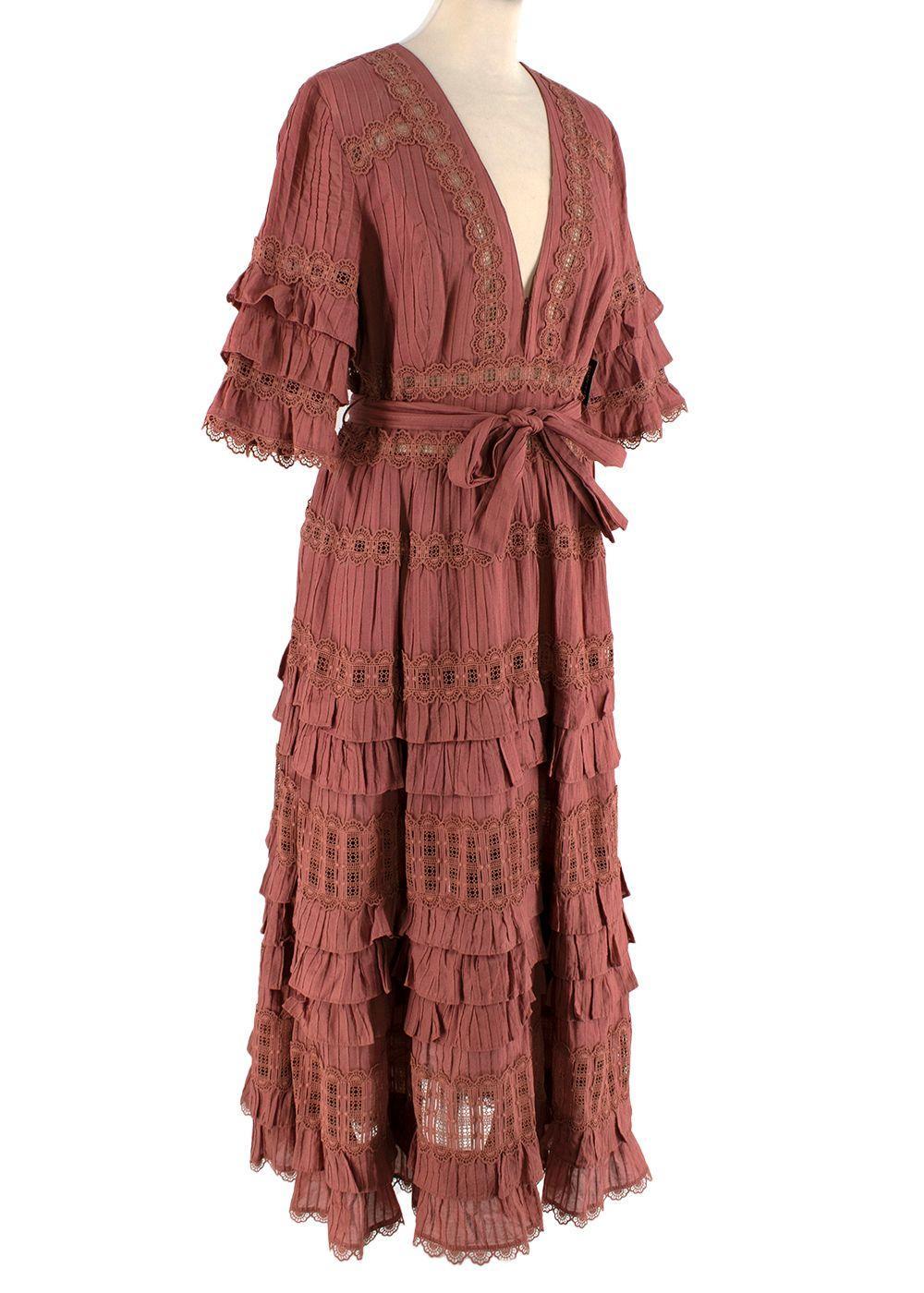 Zimmermann Vintage Rose Pin-Tucked Cotton Tiered Dress

- Warm muted rose hue
- Lightweight cotton with narrow pin-tucks
- Deep, lace trimmed v-neck
- Tiered, ruffled half sleeves and maxi hemline
- Self-tie belt
- Concealed side zip