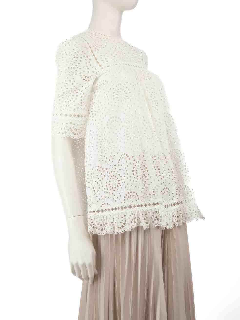CONDITION is Very good. Hardly any visible wear to the top is evident. However, due to poor storage, there is a mark on the rear left shoulder on this used Zimmermann designer resale item.
  
  Details
  White
  Cotton
  Short sleeves top
  Broderie