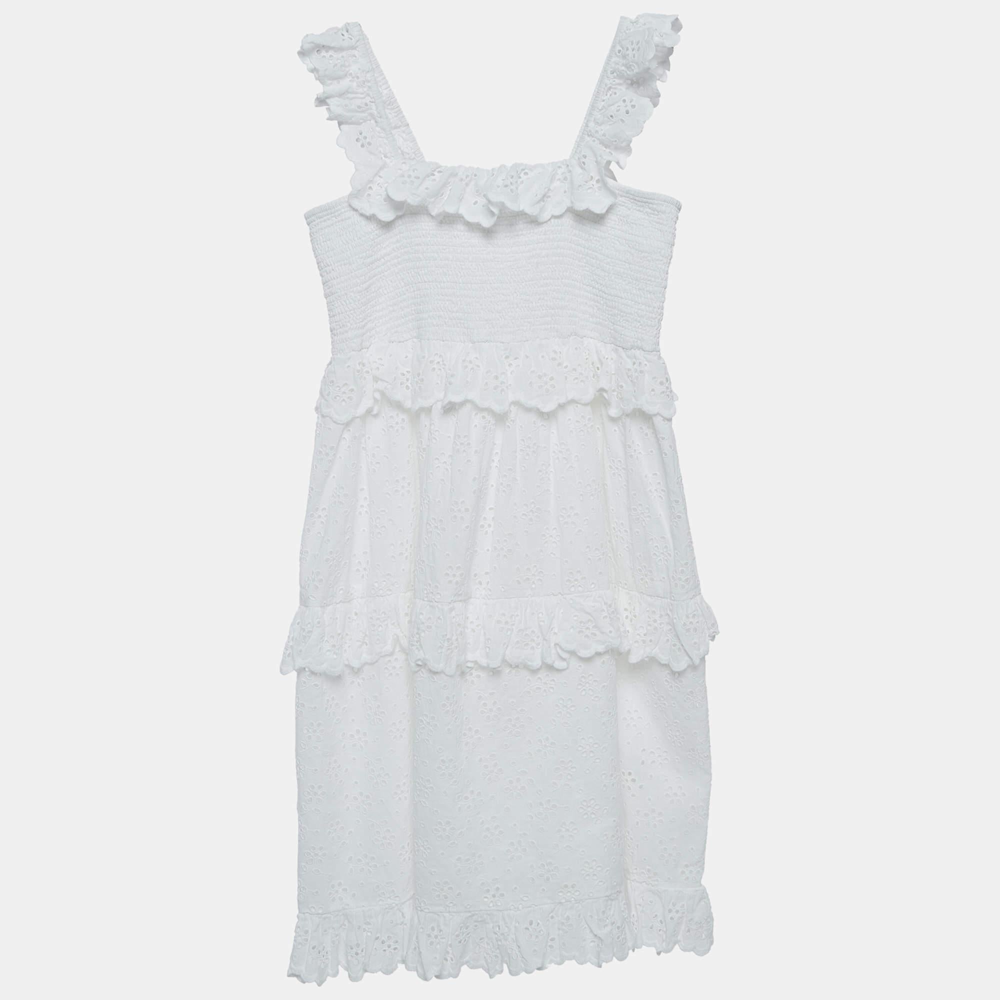 For your little one we bring you this cute Zimmermann dress made using soft cotton in a white hue. It has eyelet details all over with ruffles on the sleeve straps. Pair the dress with white sneakers and she is ready for a day out.