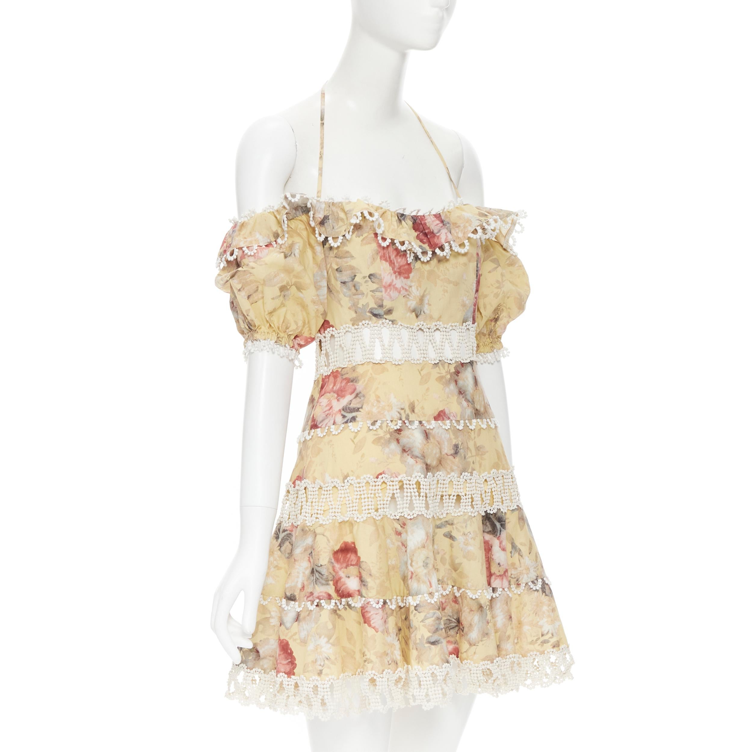 ZIMMERMANN yellow floral print lattice trim boho off shoulder dress S 
Reference: TGAS/B01393 
Brand: Zimmermann 
Material: Cotton 
Color: Yellow 
Pattern: Floral 
Closure: Zip 
Extra Detail: Elasticated off shoulder sleeve. Halter tie back with
