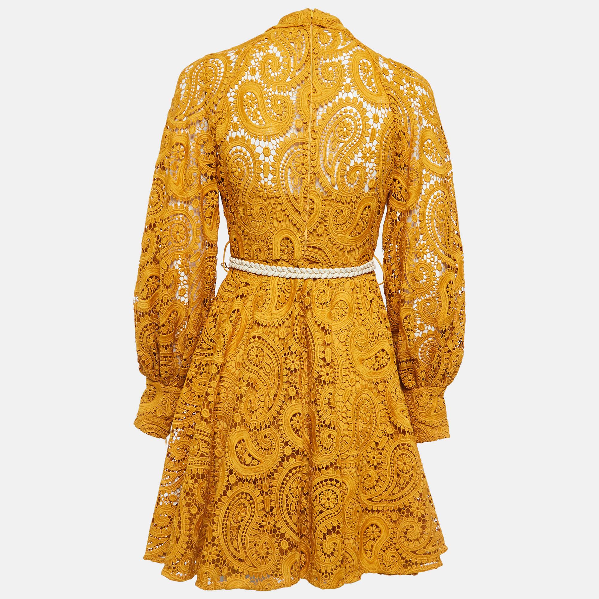 Drape yourself in the exquisite charm of the Zimmermann dress. Delicately crafted with intricate paisley lace, this dress boasts a playful yet elegant vibe. The sunny yellow hue radiates warmth, while the mini length adds a flirtatious touch.