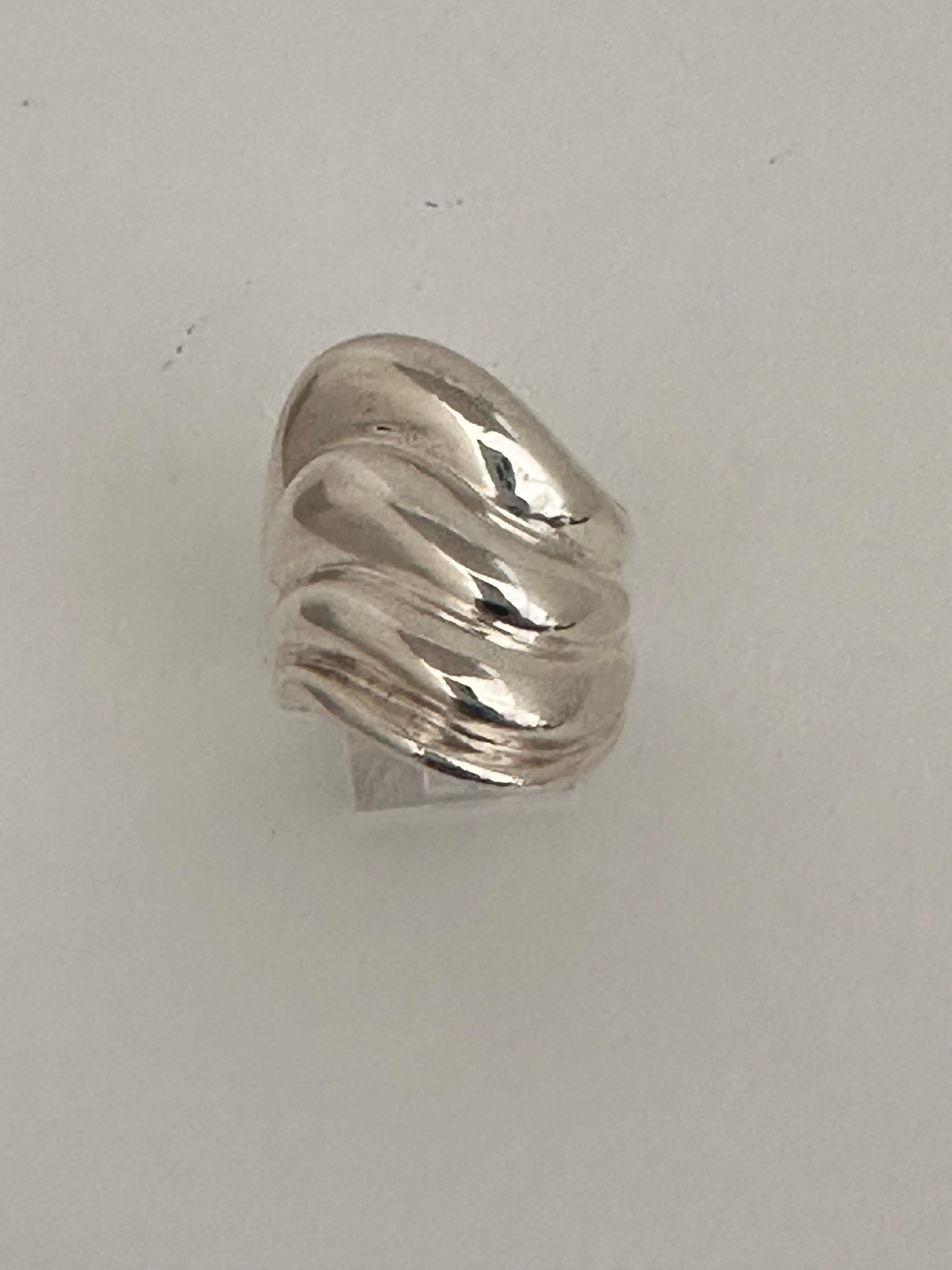 ZINA ~ Sterling Silver .925 ~ ZINA ~ 26mm x 22mm ~ Wave Ring ~ Large heavy Ring
Size 7 1/4

THEORY OF GIVING:
Silver has been important to mankind since before the Bible was written. It was used to appease kings, emperors, and conquerors. 
Silver