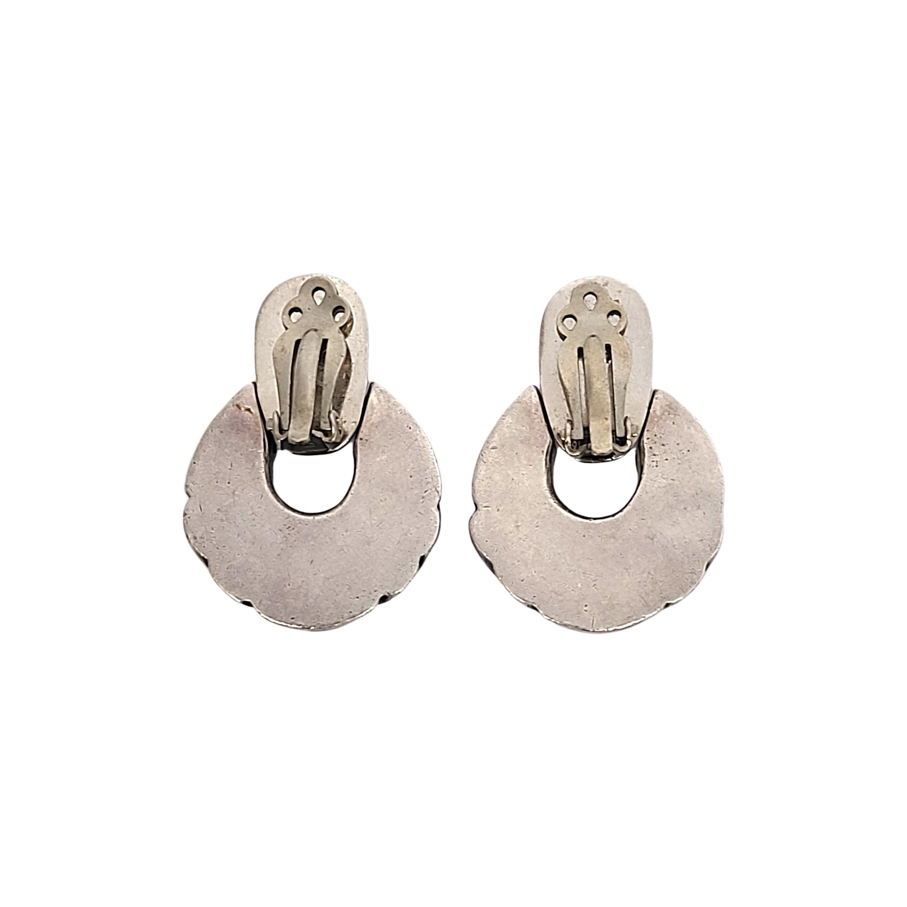 Sterling silver clip-on door knocker earrings by Zina.

Large and substantial door knocker design earrings.

Measures approx 1 1/4
