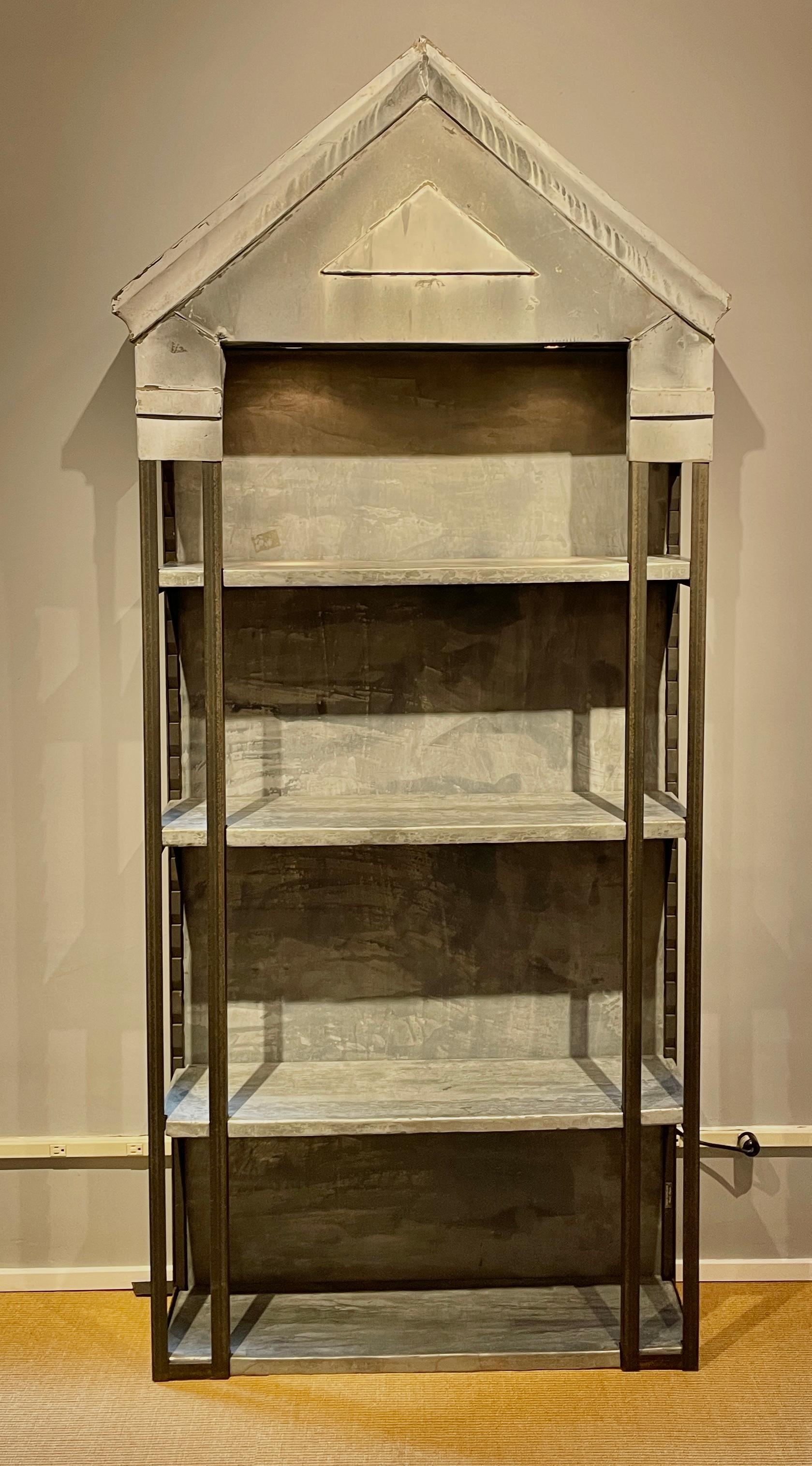 Unique shelving unit created by a Belgium designer, Francine Villier-Levy. This tall unit in created using a zinc window pediment from a Parisian building and adding a steel frame and zinc covered shelves. The shelves are all adjustable and the unit