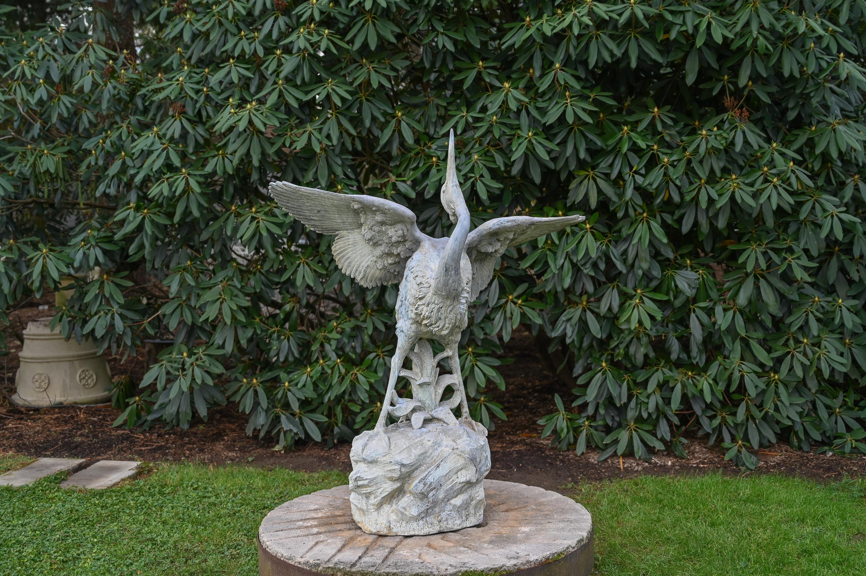A zinc fountain figure marked 