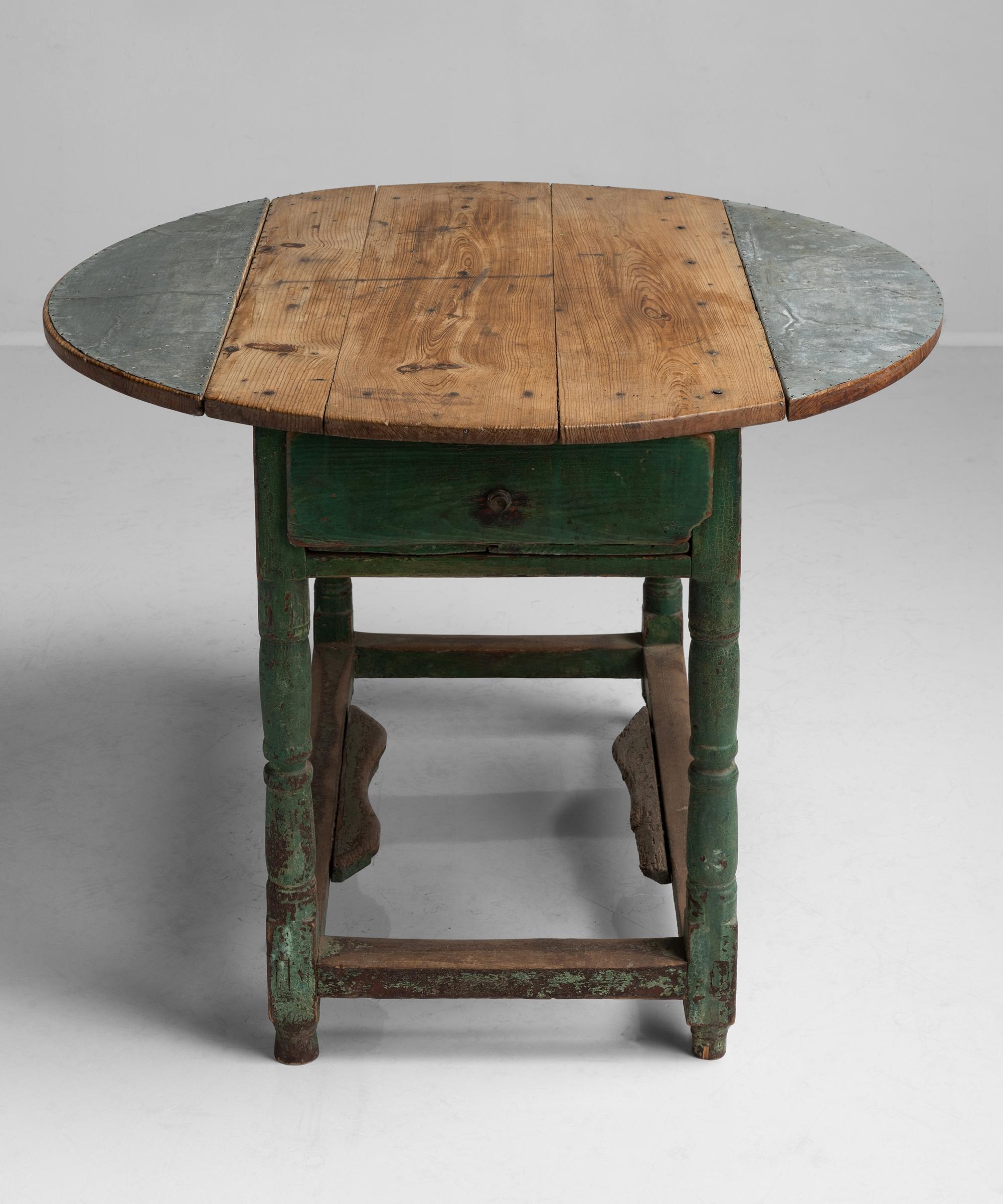 Folding top with zinc accents and remnants of original green paint.

Measures: 38” diameter x 28.5” height (fully open) 21.75” width x 38” depth x 28.5” height (sides down).
 
 
  