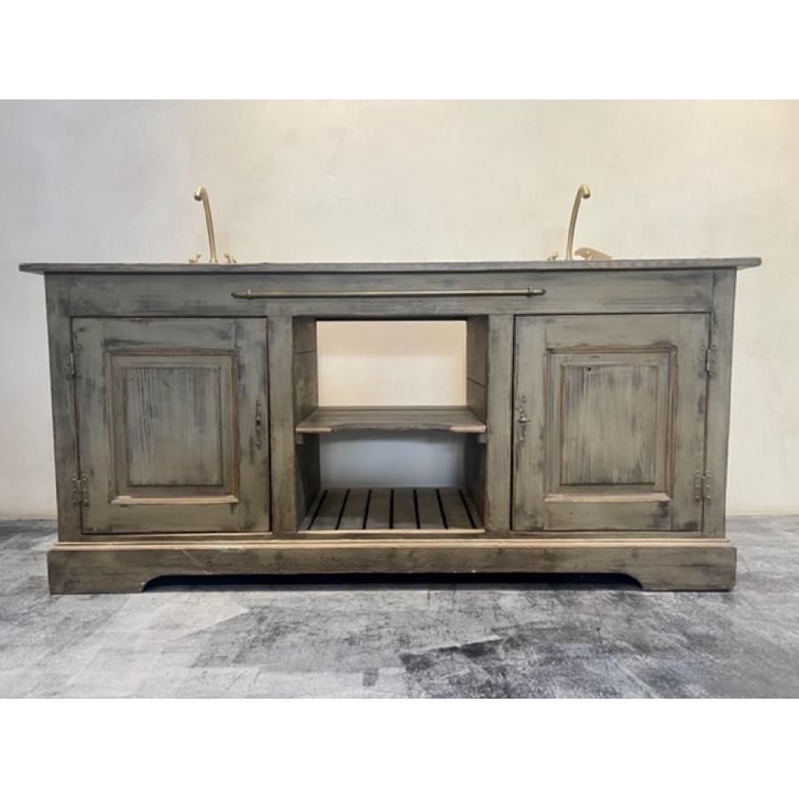 Zinc top cabinet with double sinks. Includes faucets and sinks. Functional cabinets below sinks with open center shelf unit perfect for towels. Hand painted and glazed with a distressed look. Zinc top hammered metal with intentional pitting. Brass