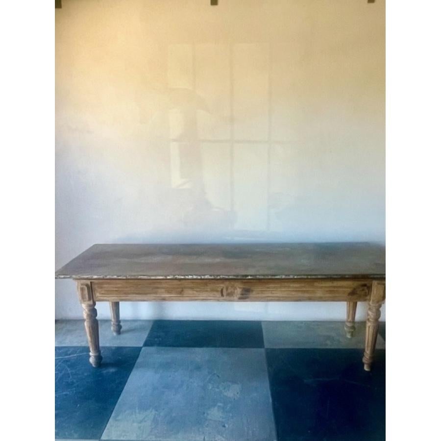 Zinc top dining table with wood base. Patina on top show in photos and base has been stripped of paint. 

Item #: FR-1144

Material: Zinc and Wood 
Dimensions: 92.5