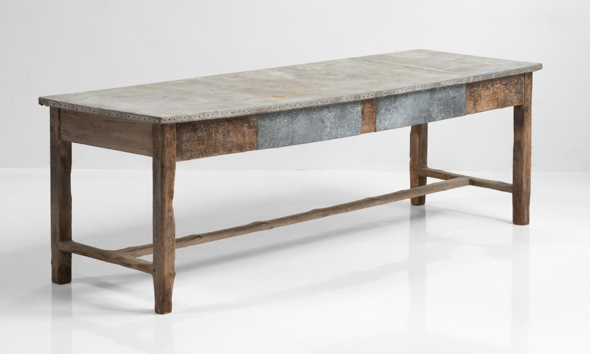 Zinc top work table, England, circa 1900

Beautifully patinated form with original zinc top and apron patchwork.