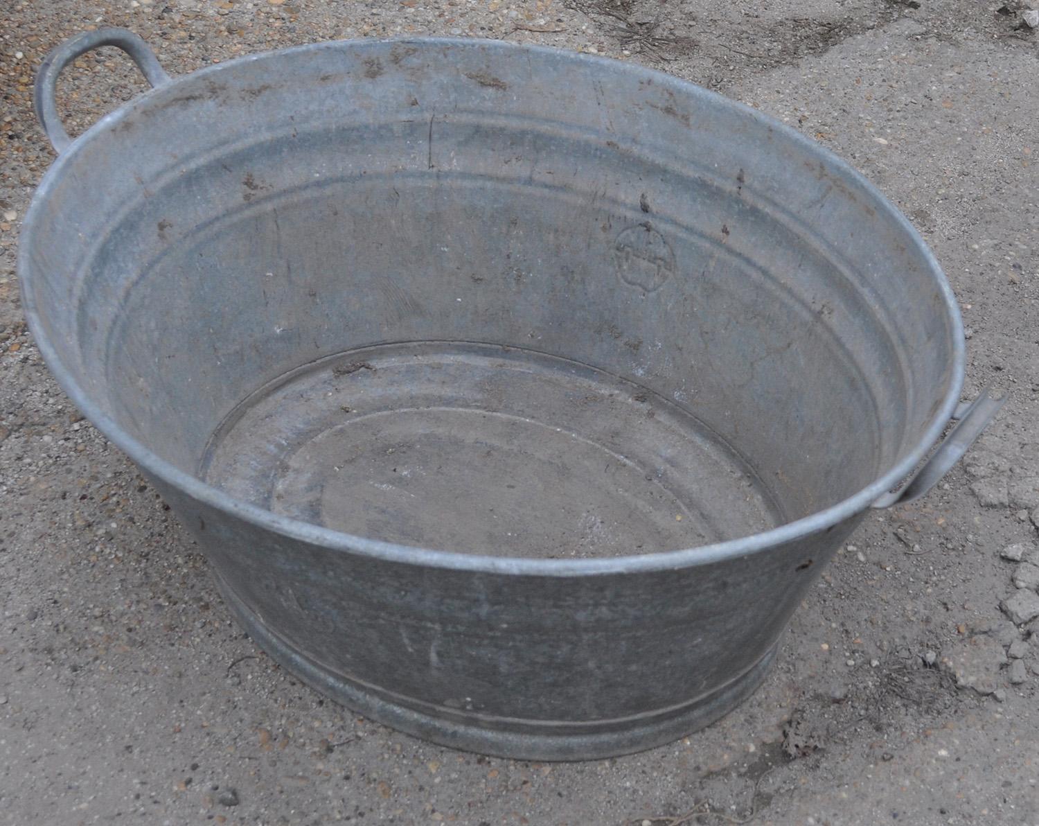 Zinc tub from Hungary
Double-handled zinc tub found in Hungary
Color: Silver patina galvanized
Materials: Metal/zinc
Condition: Very good; vintage patina, used
Measures: Length (Depth) 23.23 in
Width 31.5 in
Height 14.17 in.