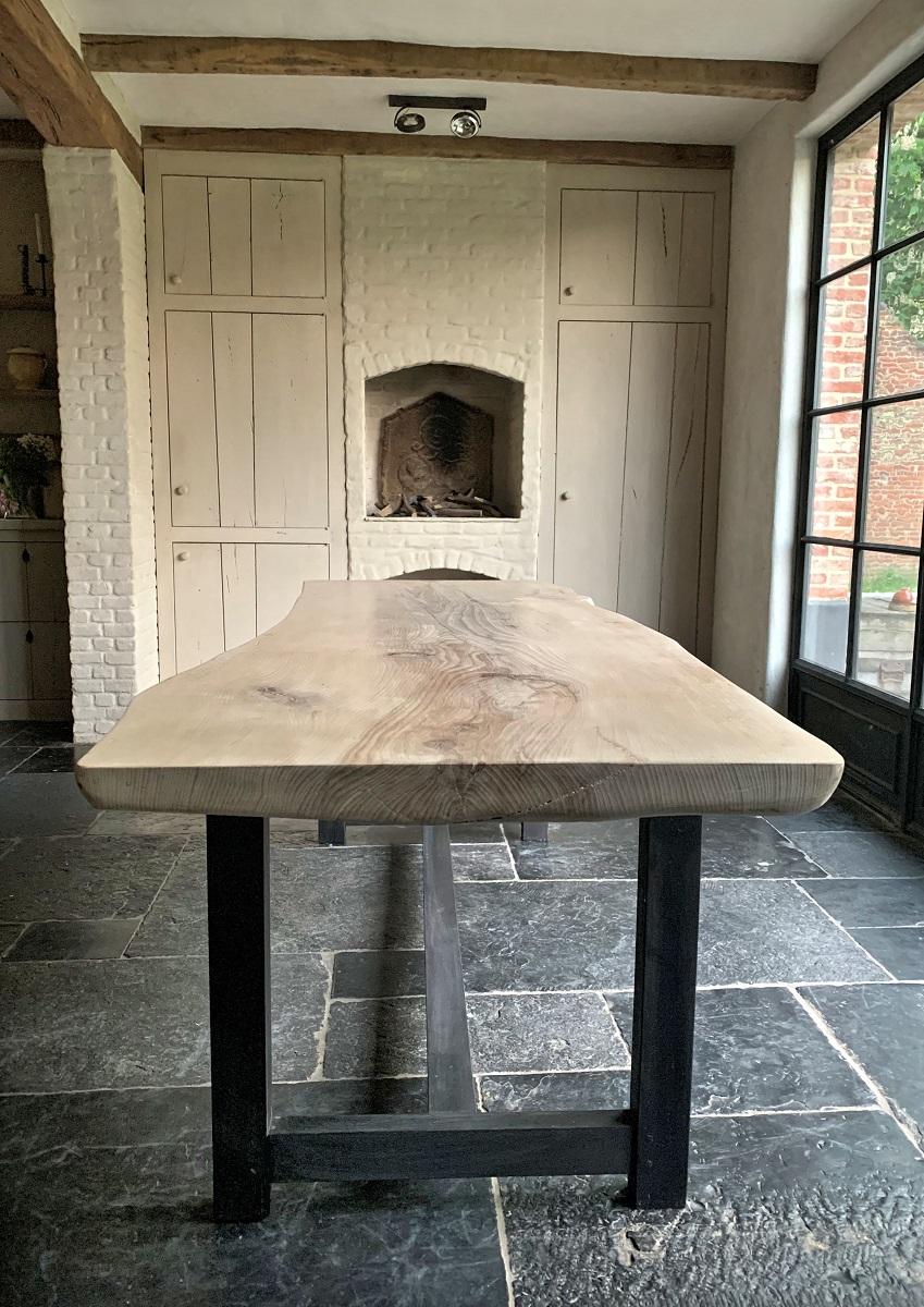 We designed and made this table starting from a locally harvest beech tree. As it had to make way from a construction site we purchased some beautiful tree's. After drying we started to process the wood and let it tell us what to use for what