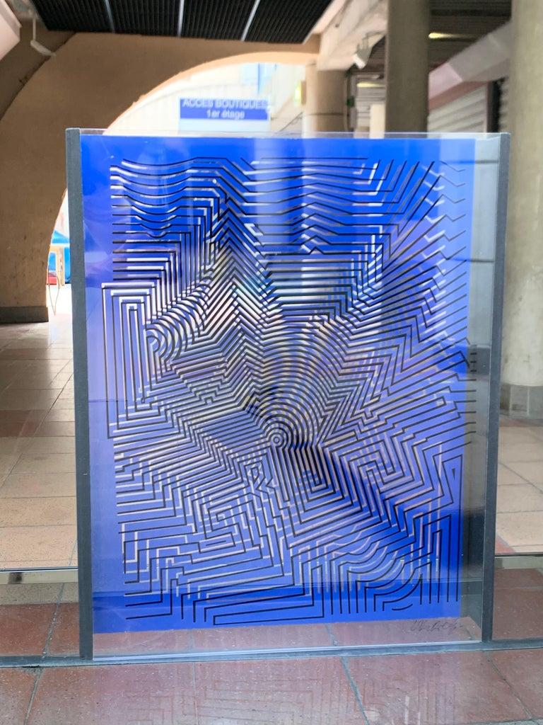 Victor Vasarely
Zint - Sculpture by Vasarely Circa 1975
Plexiglass

Zint - Sculpture by Vasarely 

Circa 1975
Sculpture consisting of two silk-screen prints on plexiglass linked by a fabric ribbon. 

Work signed by the artist.

Dimensions