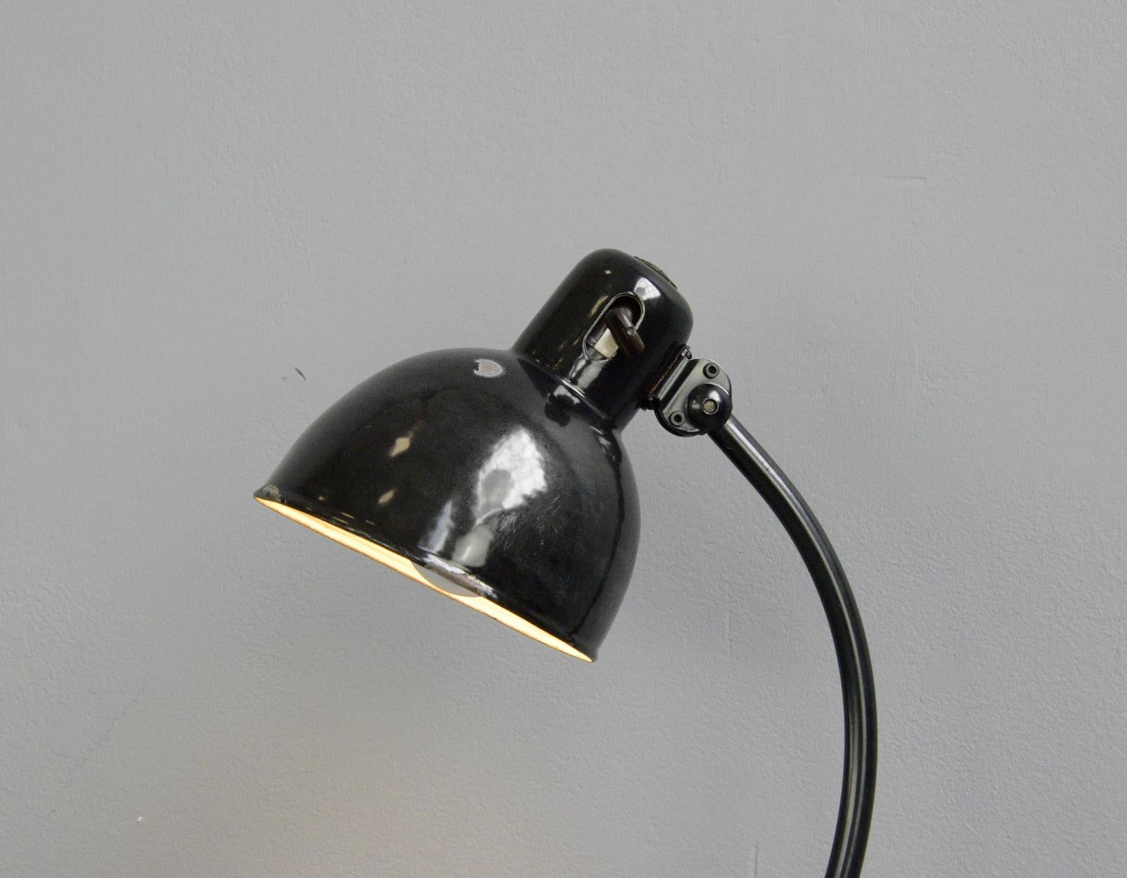 Zirax table lamp by Schneider, circa 1930s

- Vitreous black enamel shade
- Original On/Off toggle switch on the shade
- Stepped cast iron base
- Adjustable shade and arm
- Takes E27 fitting bulbs
- Produced by Dr. Ing. Schneider & Co,
