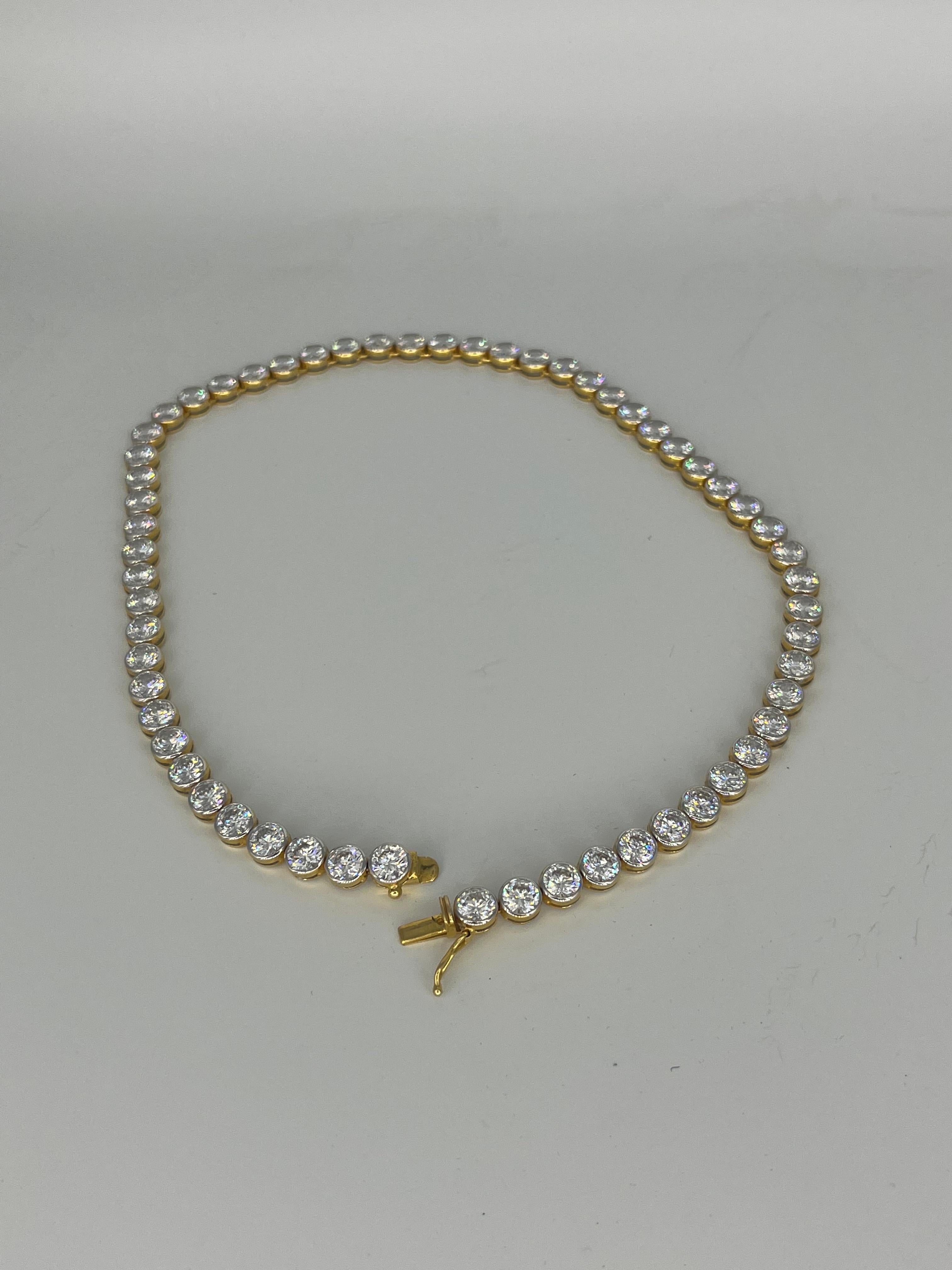 cambodian zirkon necklace
18 k yellow gold
62,5 gram
45 cm long
width ca 1 cm

