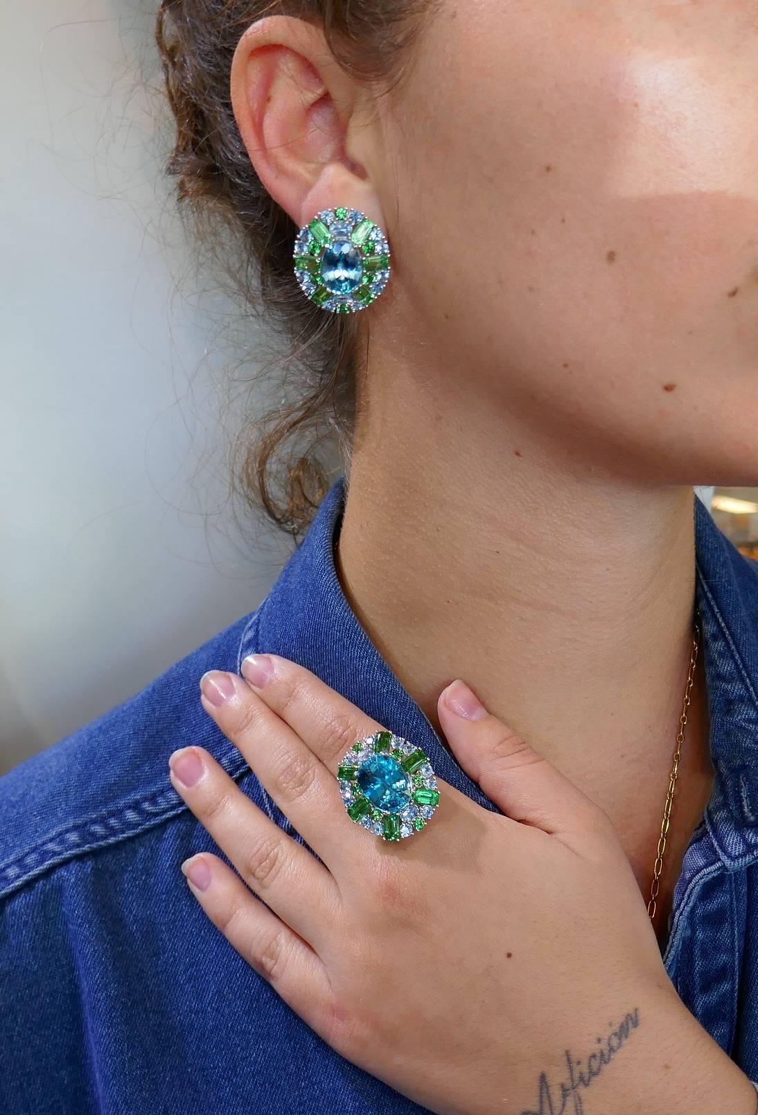 Colorful and chic multi-gem set consisting of a ring and a pair of earrings. Summery, elegant and wearable, the set is a great addition to your jewelry collection.
The set is made of platinum and features beautiful color blue zircons accented with