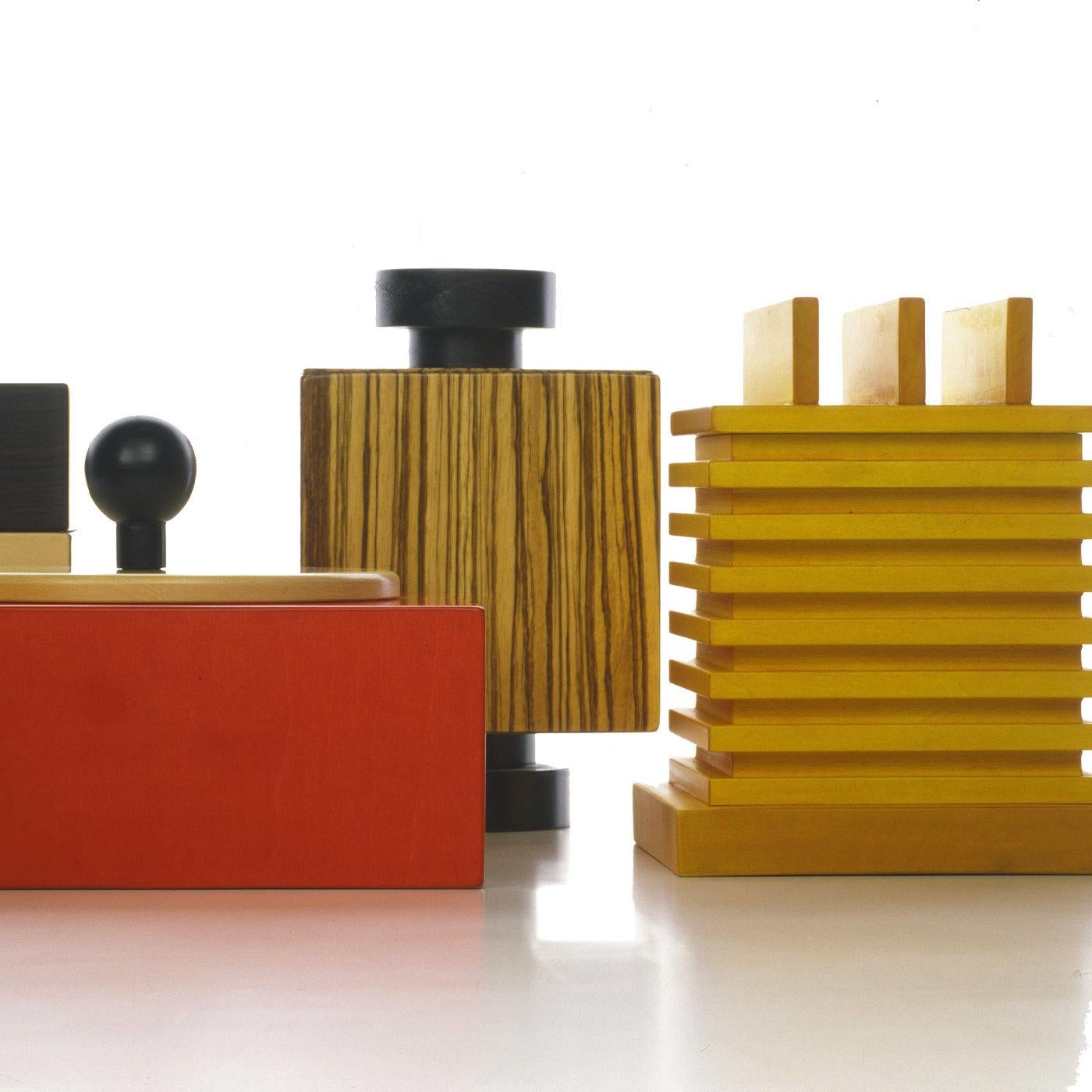 A sculptural piece of strong architectural allure, this box is an exclusive design by Ettore Sottsass produced in a limited edition of 99 pieces. Reminiscent of a modern city building, it is entirely crafted of solid maple wood with a