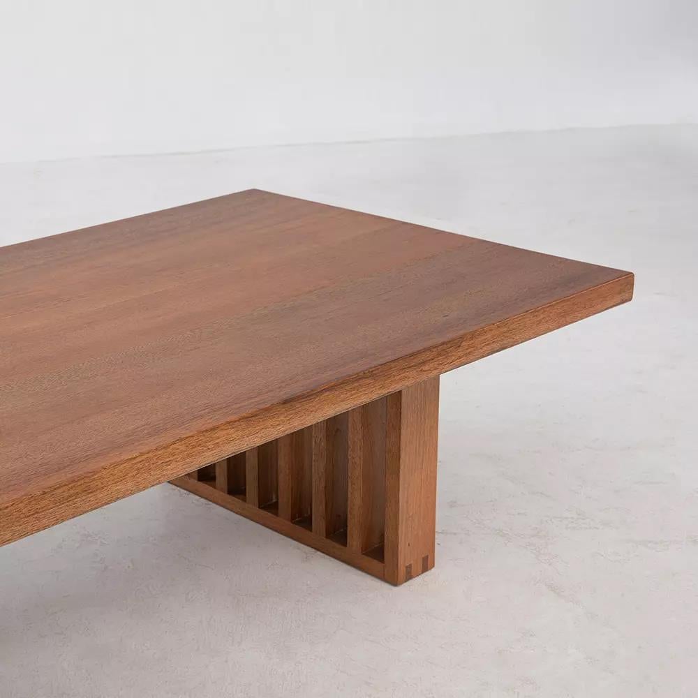 A solid Makata hardwood tabletop is perched above the strong lines of the slatted wood base in the Zither Coffee Table. Designed with great attention to proportion and detail, the Zither Coffee Table adds a warming, calming presence to the home.