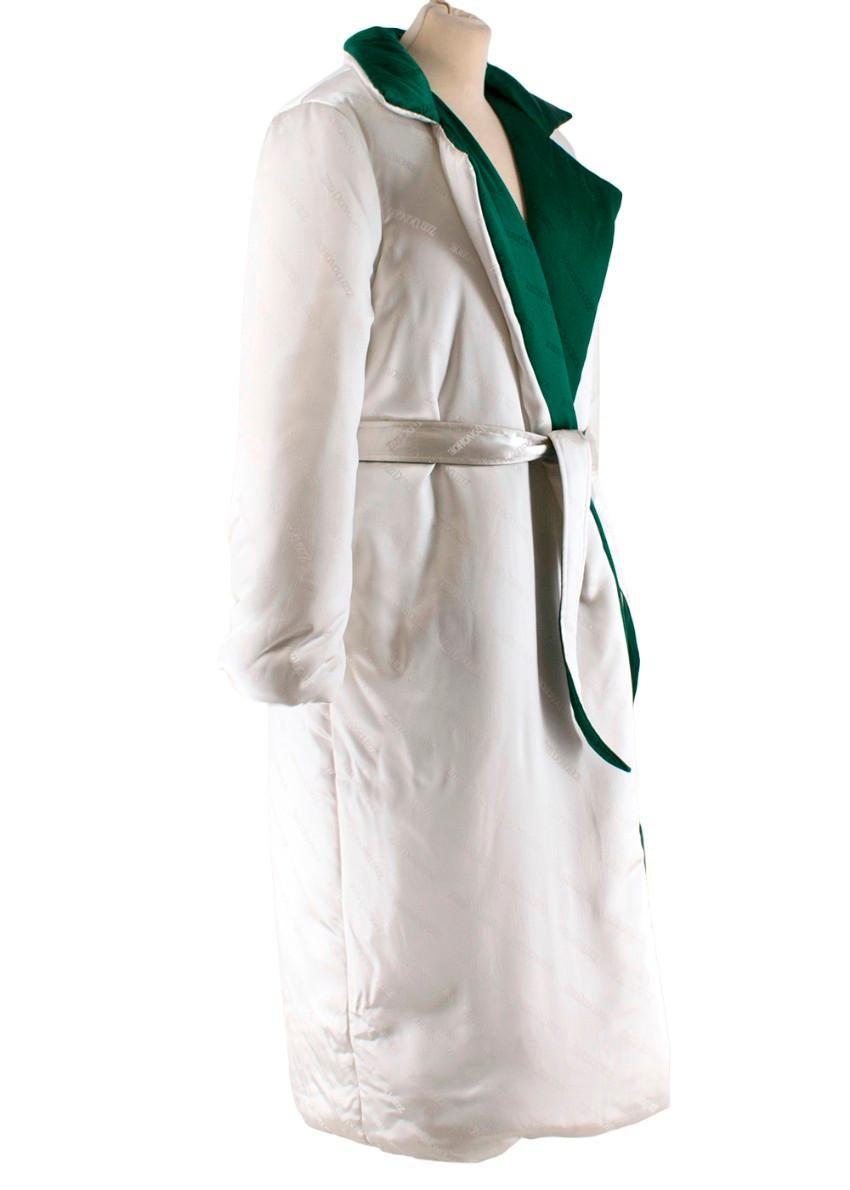 Zizi Donohoe Silk Duvet Coat

- Signature brand silk jacquard
- Puffy reversible coat in Emerald and Pearl
- Double sided waist sash
- Subtle tonal pockets
- Notched collar 
- 100% heavy weight couture grade silk
- Made to order item 

Materials