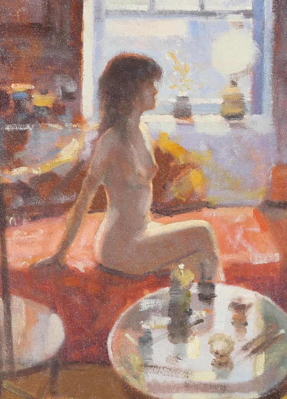 A colourful interior scene, showing a life model poised on the edge of a Chaise Lounge. Beautifully lit by natural daylight. The painting has been well-presented in a 20th Century moulded frame. Unsigned. On canvas board. 
