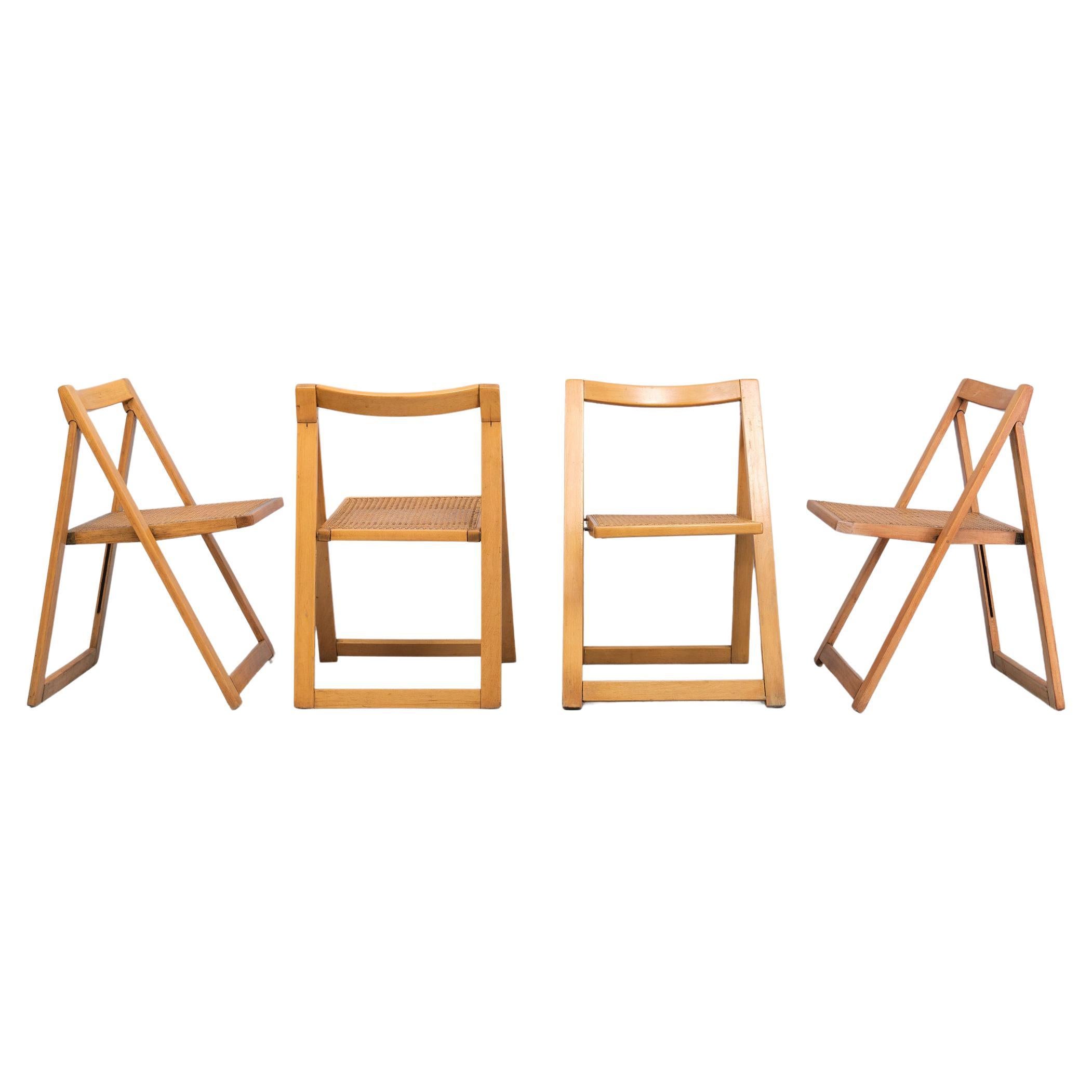 Very nice set of Beech wood folding chairs ,comes width Wicker seats .    
set of four  of Vintage Mid-Century ZMG Radomsko 
The chairs made by Polish furniture maker Radomsko ZMG, famed for also making Thonet chairs (same factory) are in a good