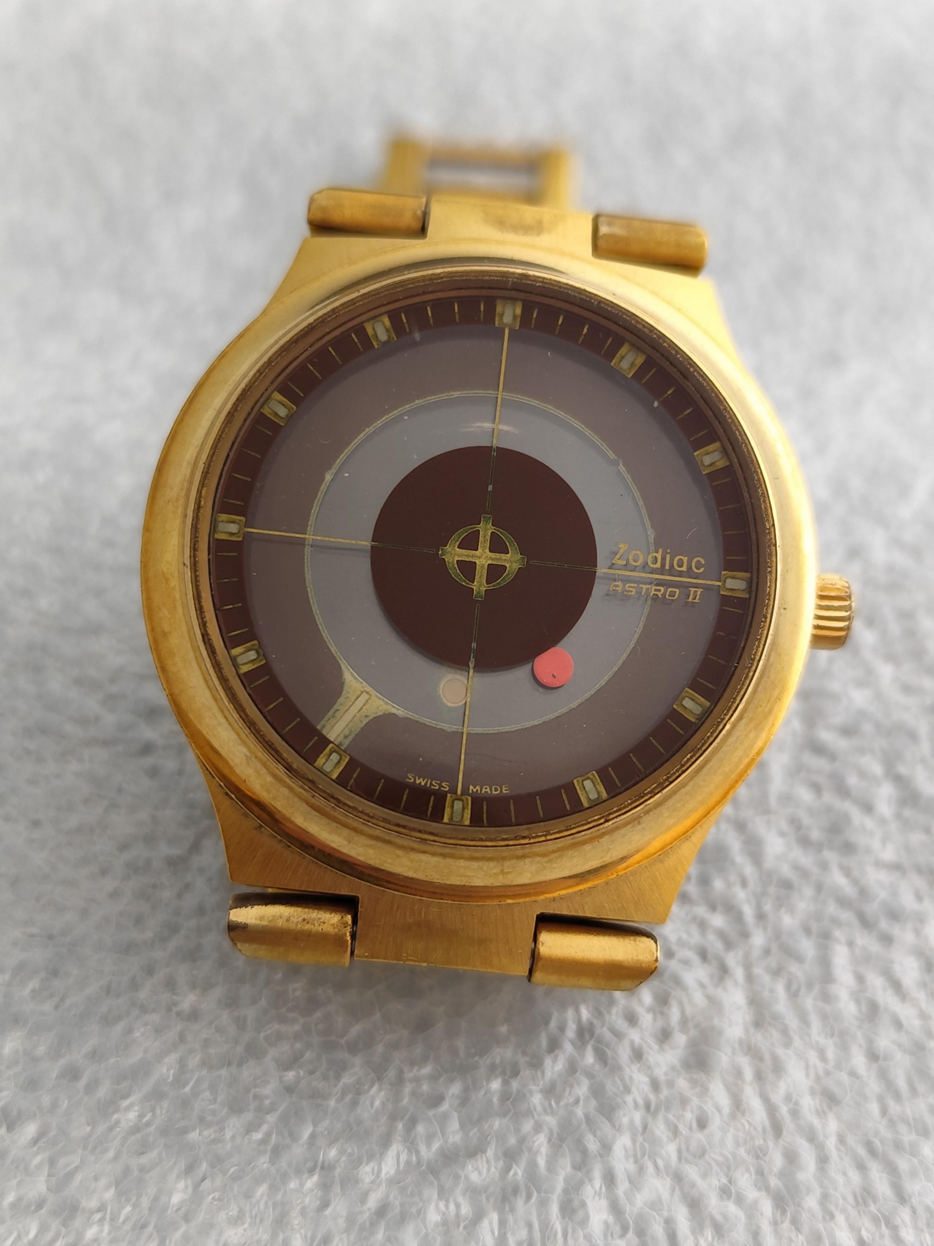  Description
Brand: Zodiac

Model: Astro II Astrographic

Price :750 USD

Country Of Manufacture: Switzerland

Movement: Automatic

Case Material: Gold Plated Stainless steel

Measurements : Case width: 38 mm. (without crown)

Band Type : Gold