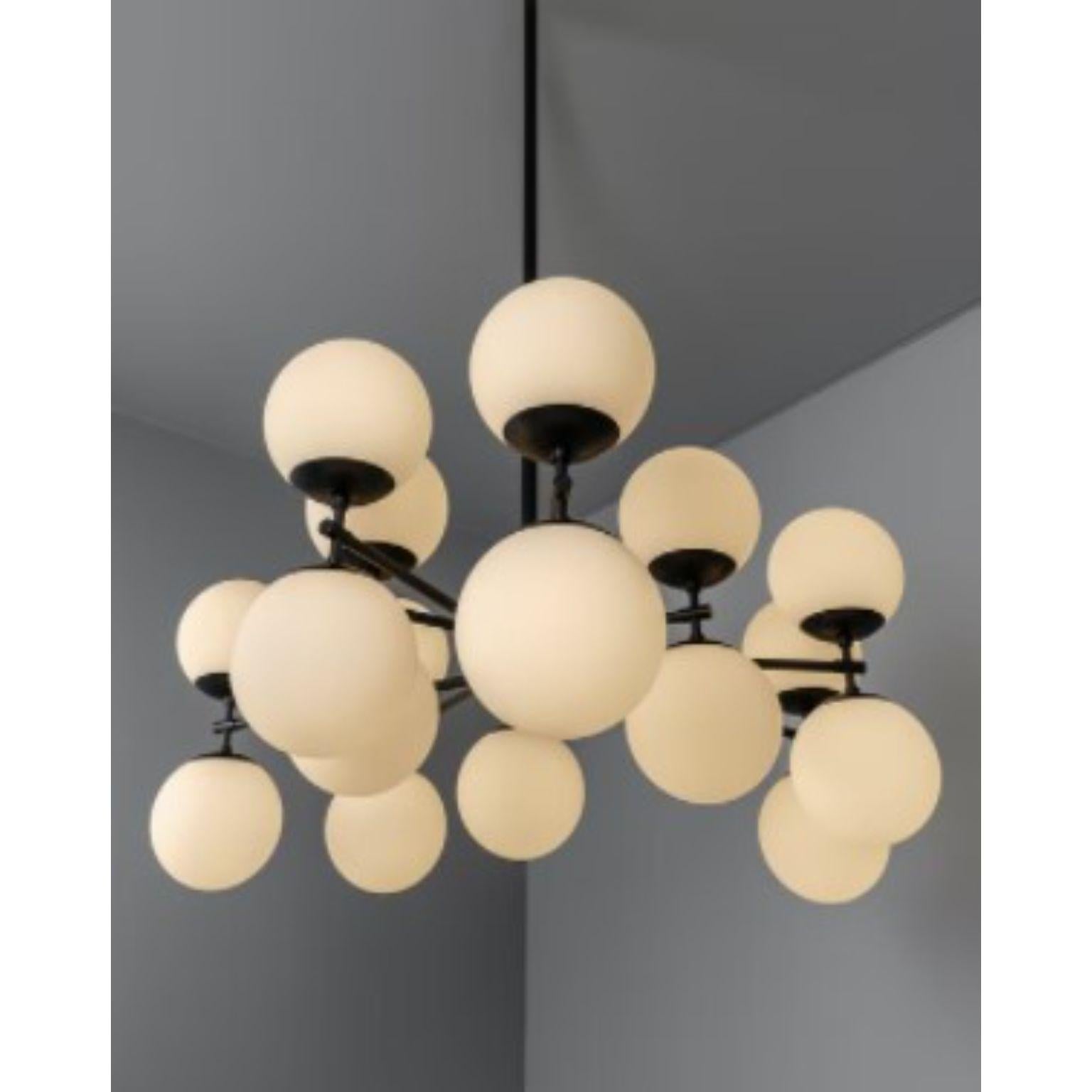 Zodiac chandelier by Schwung
Dimensions: D131.4 x H 152.4 cm
Materials: Brass, frosted glass

Finishes available: Black gunmetal, polished nickel, brass
Other sizes available.

 Schwung is a german word, and loosely defined, means energy or