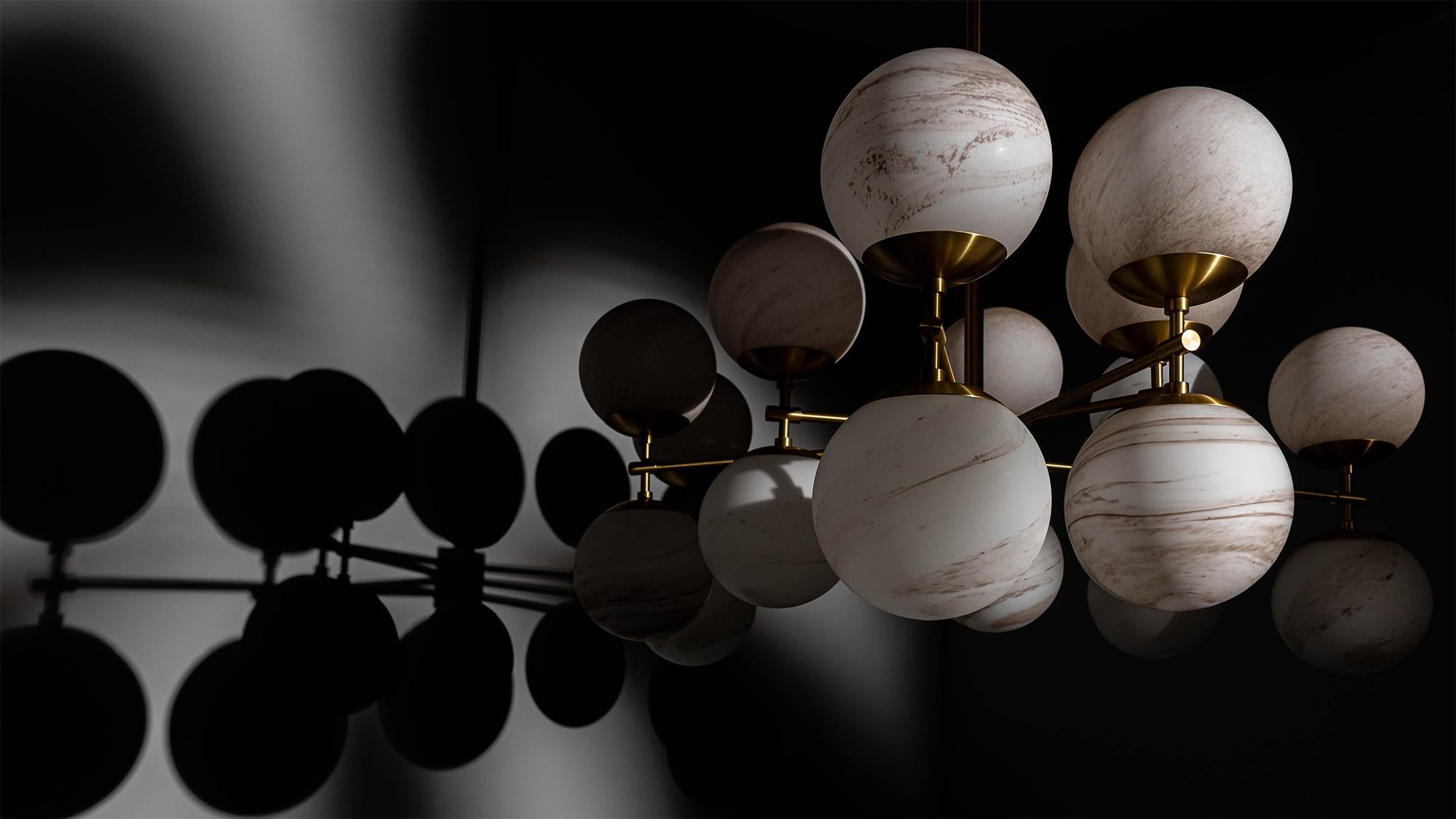 An ornamental simplicity undulates in this shape-shifting form. Globes are mirrored to create a stellar light in this gravity-defying visual constellation. Observed from various angles, Zodiac has a carousel effect with a dynamic sequence of