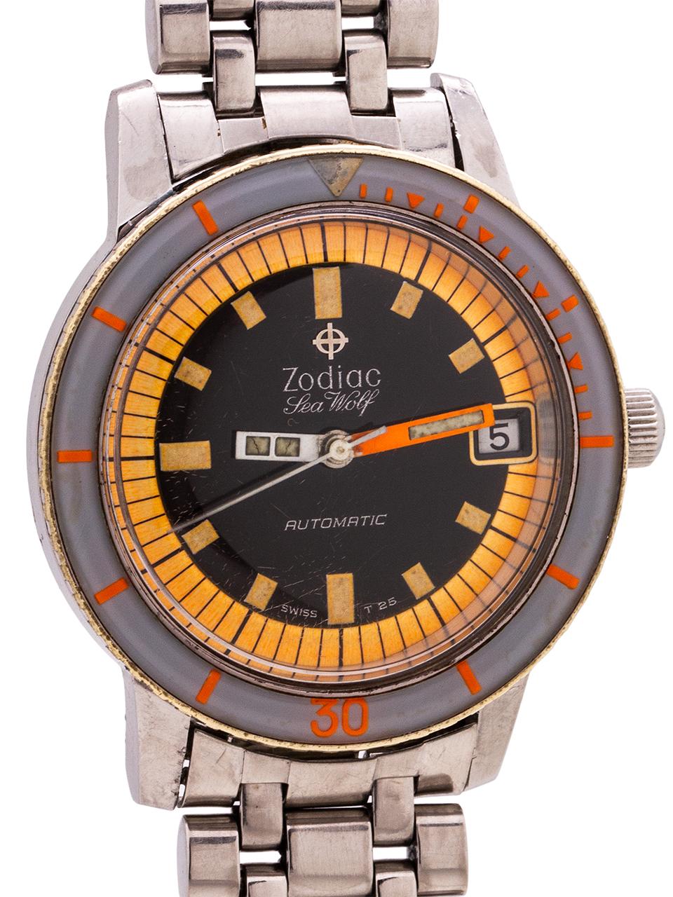 
Zodiac stainless steel Seawolf circa 1960’s. Striking looking 35.5 x 42mm example with rotating blue-gray bakelite bezel with orange hour markers, acrylic crystal, and with black dial with bright fluorescent orange outer track and luminous frames.