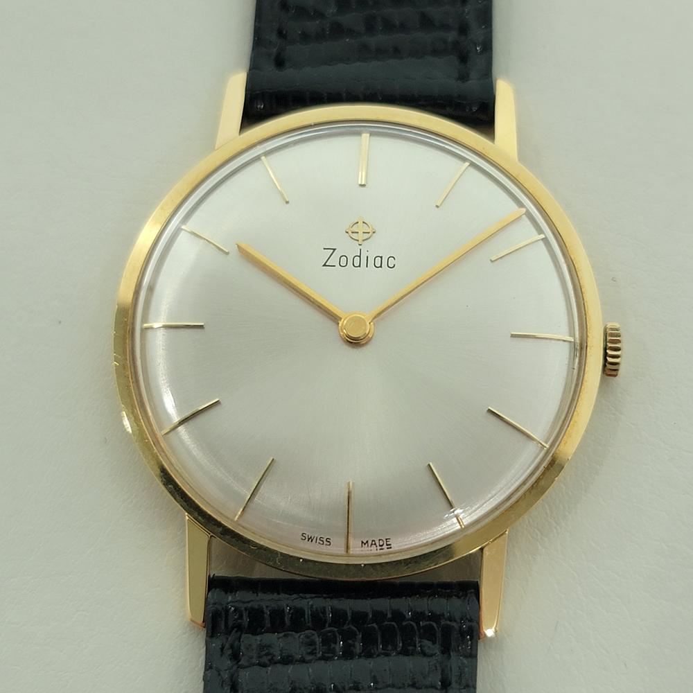  Timeless luxury, 18k solid gold Men's Zodiac manual wind ultra slim dress watch, c.1970s, in excellent working condition. Verified authentic by a master watchmaker. Gorgeous, Zodiac signed vintage dial, applied baton index hour markers, gilt minute