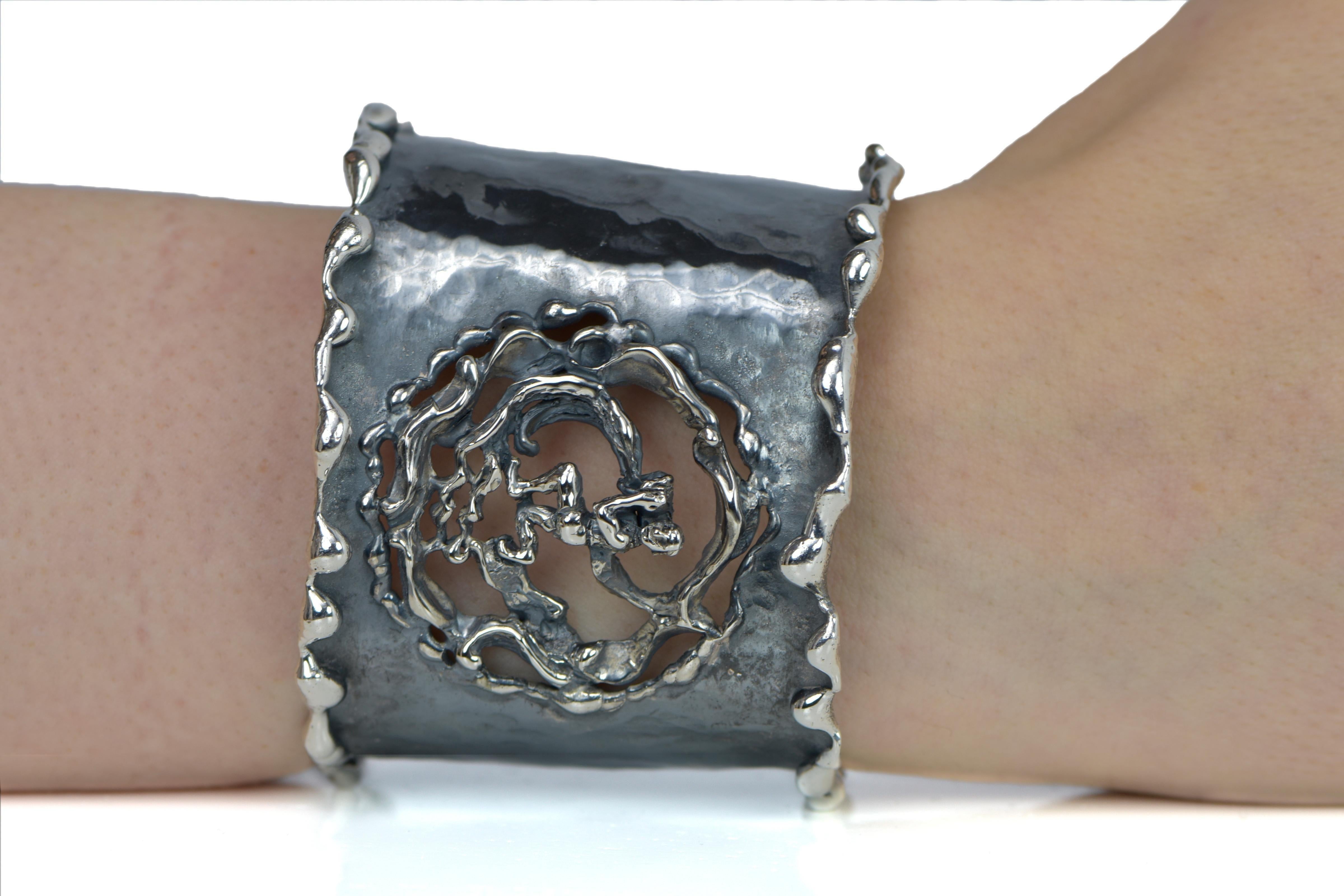 Hand Forged Silver Aquarius Adjustable Cuff Bracelet. About 2.5 inches wide. The metal does not contain any additional alloys that could compromise the strength or quality of the piece. Each Organic Silver Cuff Bracelet takes about 8 hours to