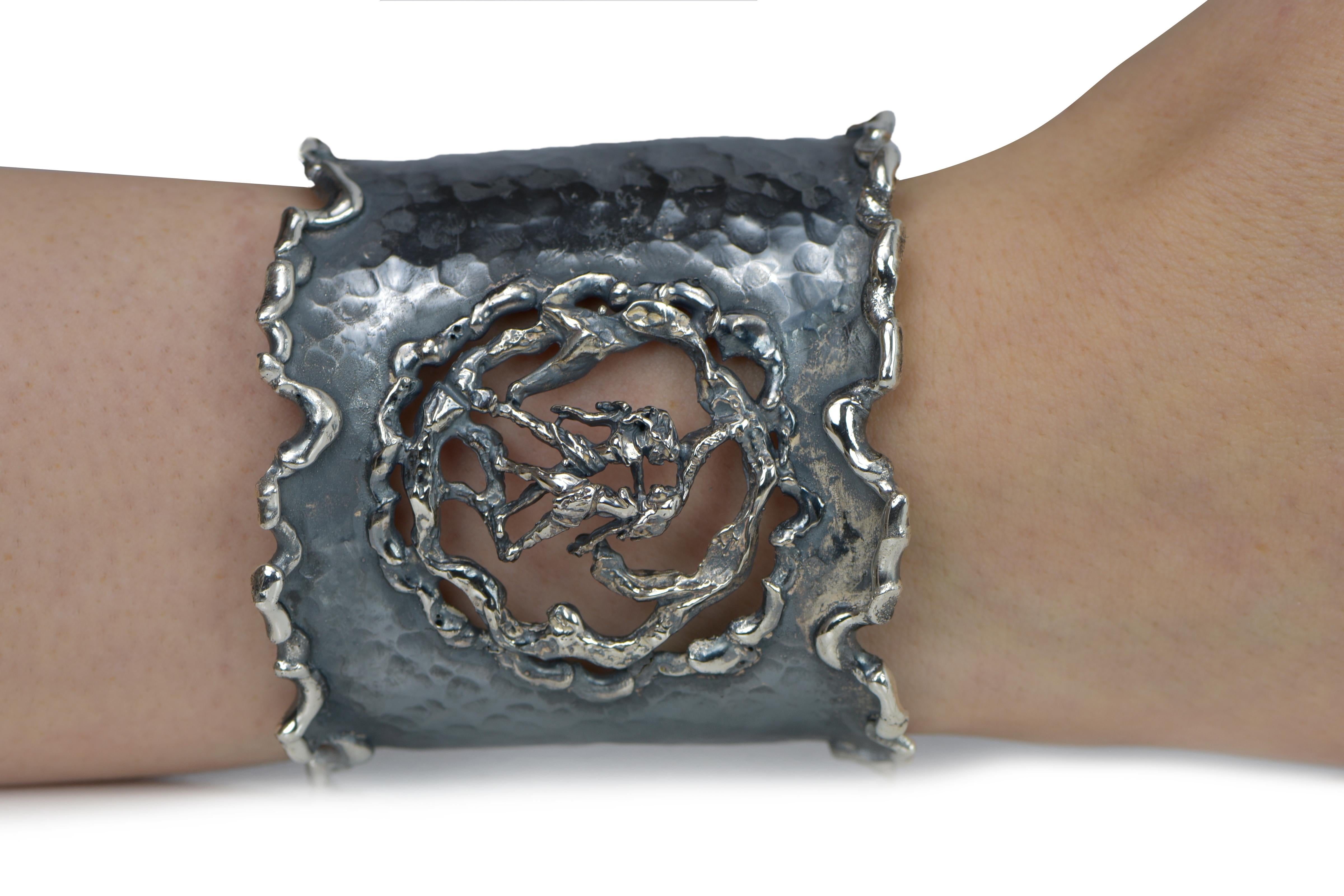 Hand Forged Silver Gemini Adjustable Cuff Bracelet. About 2.5 inches wide. The metal does not contain any additional alloys that could compromise the strength or quality of the piece. Each Organic Silver Cuff Bracelet takes about 8 hours to