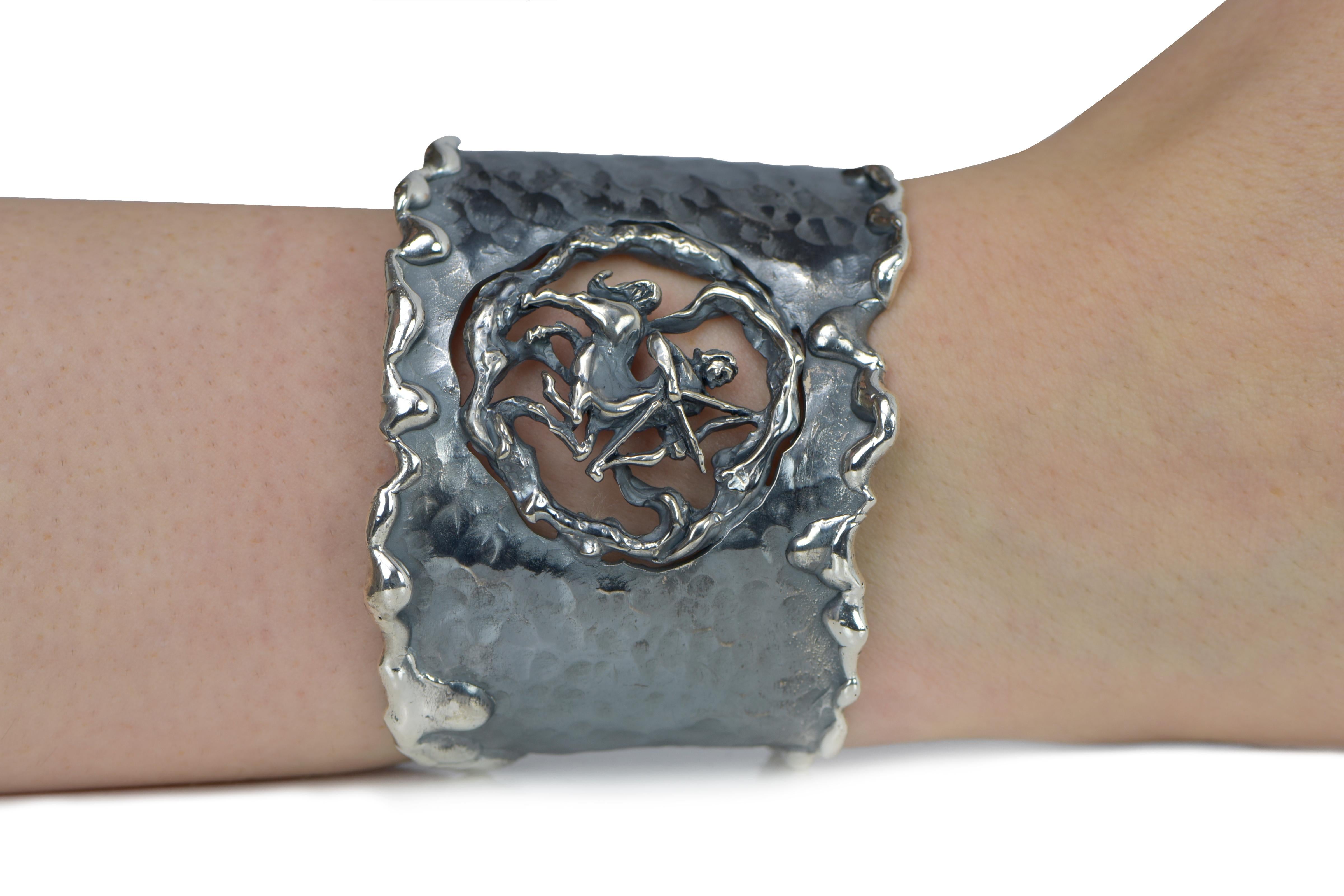 Hand Forged Silver Sagittarius Adjustable Cuff Bracelet. About 2.5 inches wide. The metal does not contain any additional alloys that could compromise the strength or quality of the piece. Each Organic Silver Cuff Bracelet takes about 8 hours to