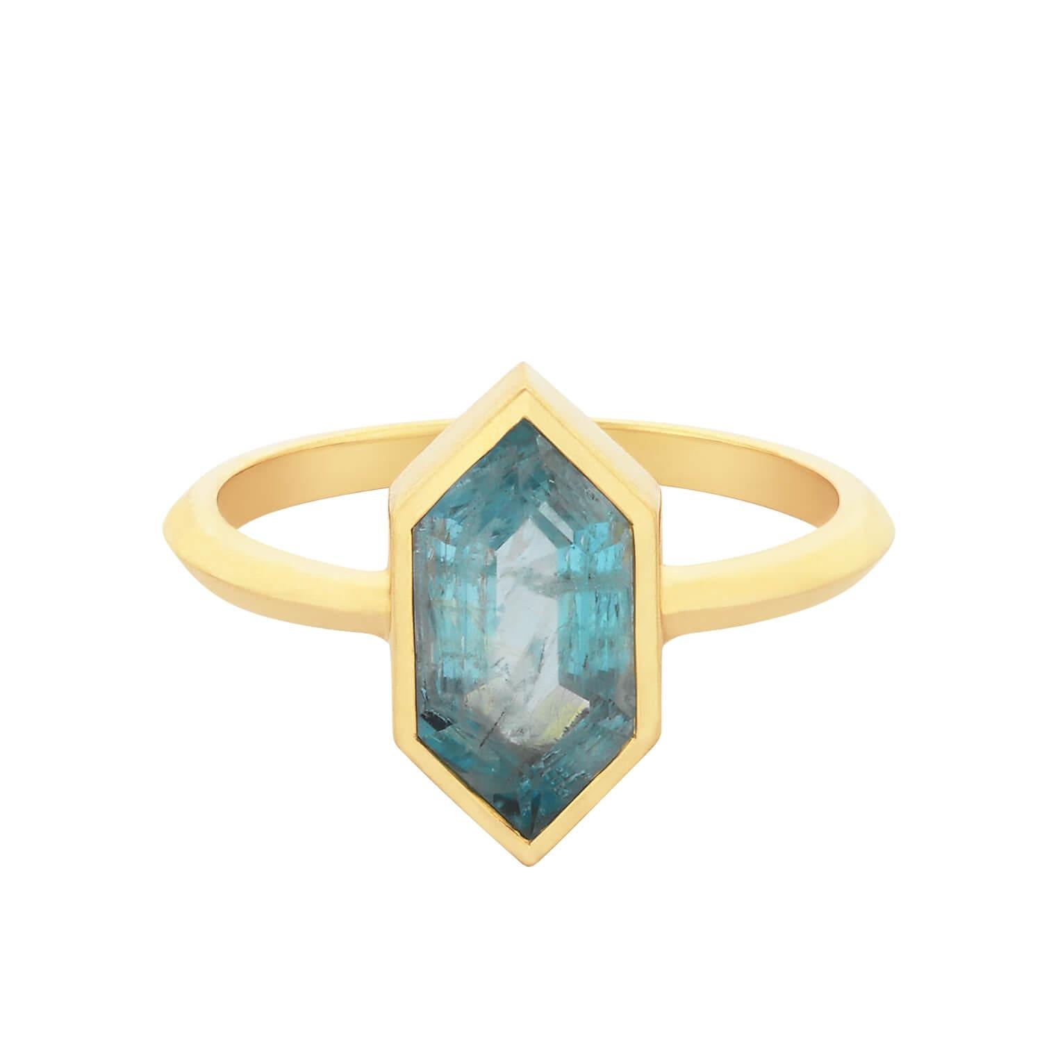 Ring size: 54

The Misti ring features an Aquamarine crystal cut set in an 18k gold frame. The pointed edge of the stone perfectly transitions into the sword edge band.

These bespoke hand cut stones make each ring truly unique, with their own