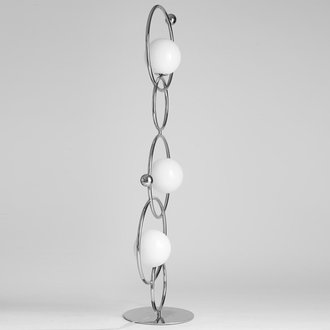 This elegant lamp is made of five metal rings with three mouth-blown Murano glass diffusers. The available finishes for the structure and the two metal round decorative elements are polished black nickel, polished gold, matte black nickel, polished