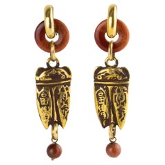 Zoe Coste Boucles d'oreilles pendantes Boho Ethnic Chic en résine dorée et marron cacao Zoe Coste Boucles d'oreilles pendantes Boho Ethnic Chic en résine dorée et marron cacao