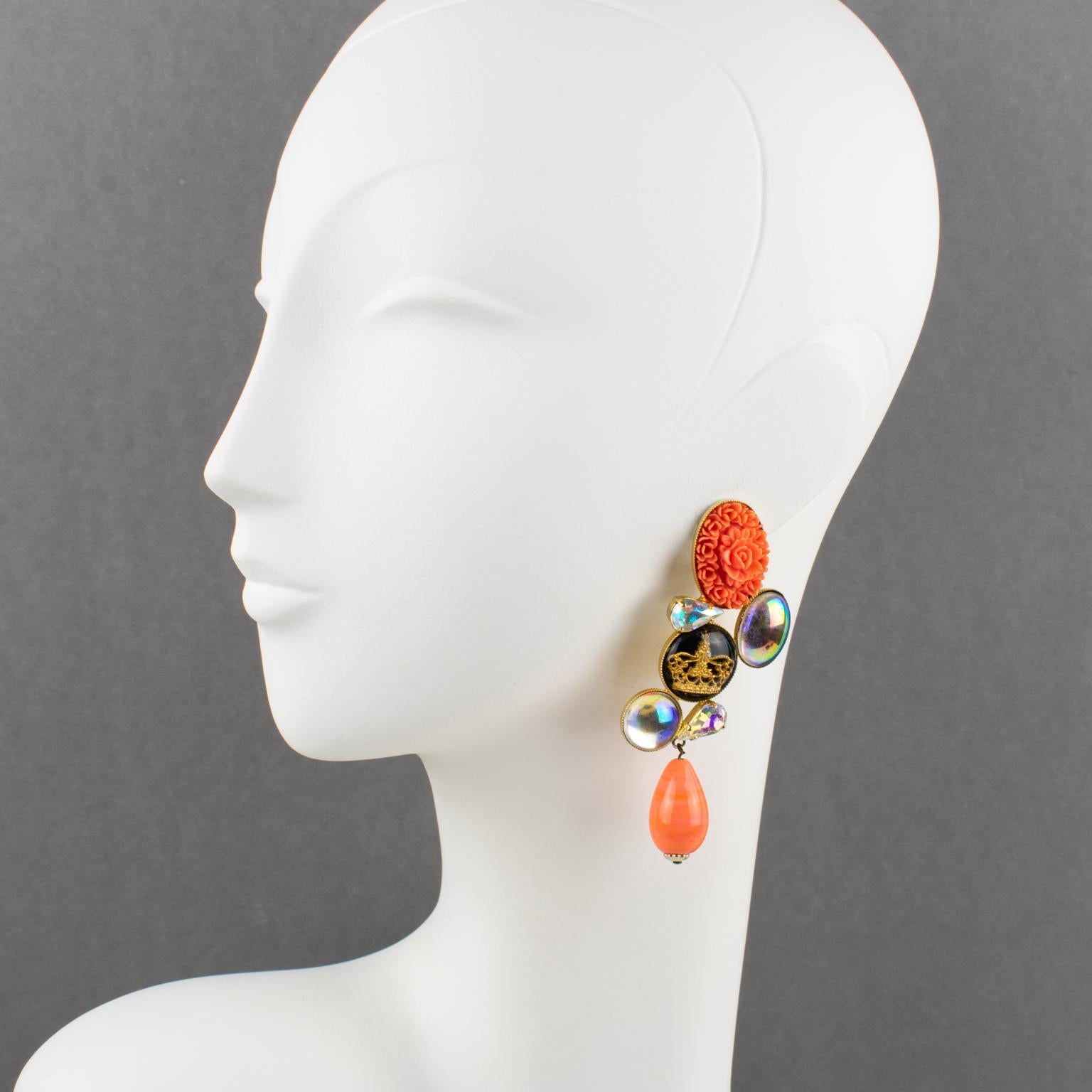 These romantic French designer Zoe Coste clip-on earrings boast a dangling shape with baroque style with a gilt metal framing, ornate with Aurora Borealis poured glass cabochons, pear-shaped faceted crystal rhinestones, a gilded crown cameo, and