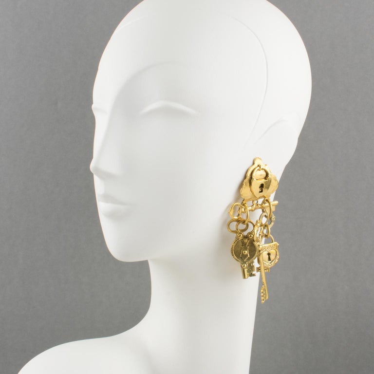 Zoe Coste Oversized Gilt Metal Dangle Clip Earrings Keys and Locks at
