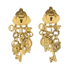 Zoe Coste Oversized Gilt Metal Dangle Clip Earrings Keys and Locks