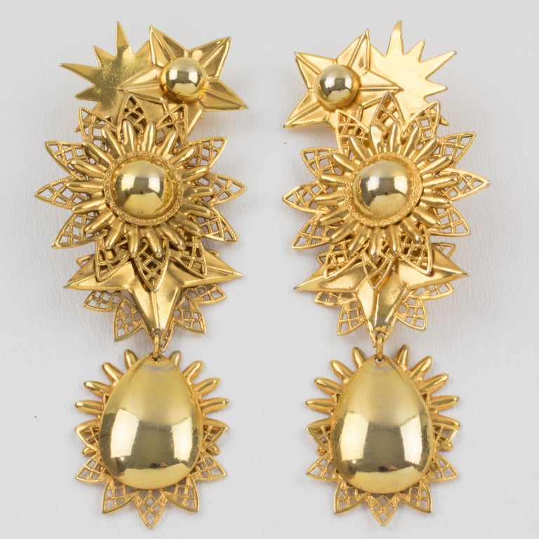 Zoe Coste Gilt Metal Dangle Clip Earrings Star and Sun at 1stDibs