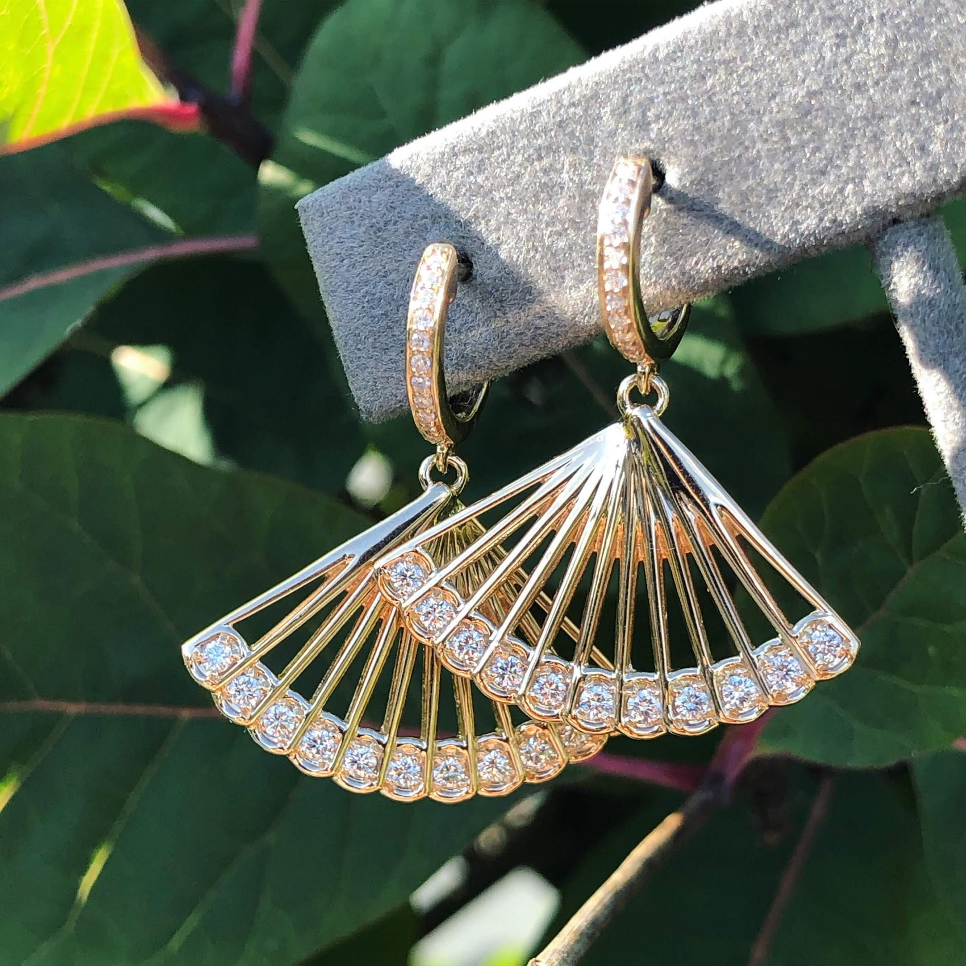 From SELIN KENT's fan-inspired Zoe Capsule, these drop earrings feature hoop earrings and a flattering fan-inspired shape with white diamond accents.

- Total carat weight: 0.6
- Total drop: 2.5'' 
- 14k Yellow Gold
