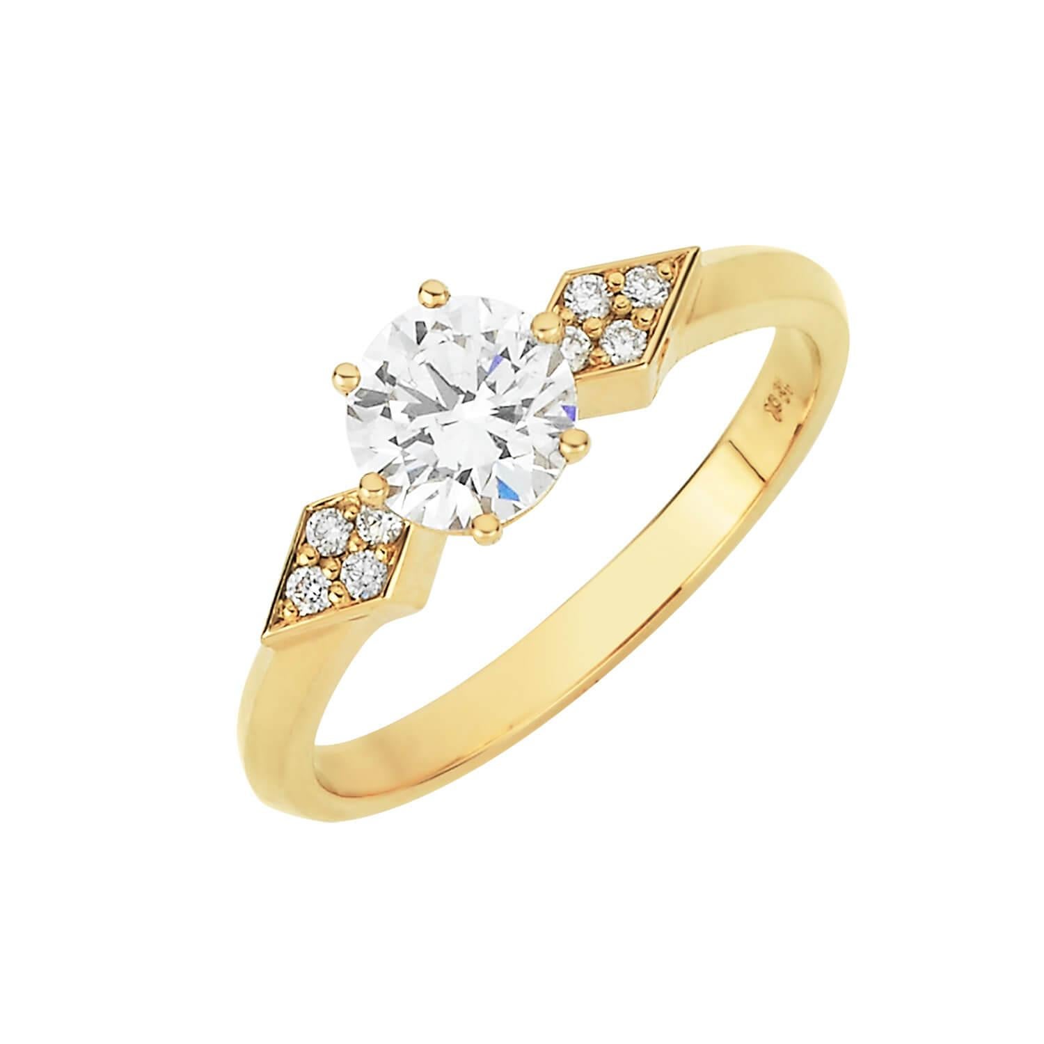 The Dahlia Engagement Ring is the symbol of the spark of love.

18k yellow gold engagement ring, with a centre diamond of 0.7ct, round brilliant cut, D colour, SI2 clarity. Set with 8 1.25mm brilliant cut diamonds.

This piece will be specially