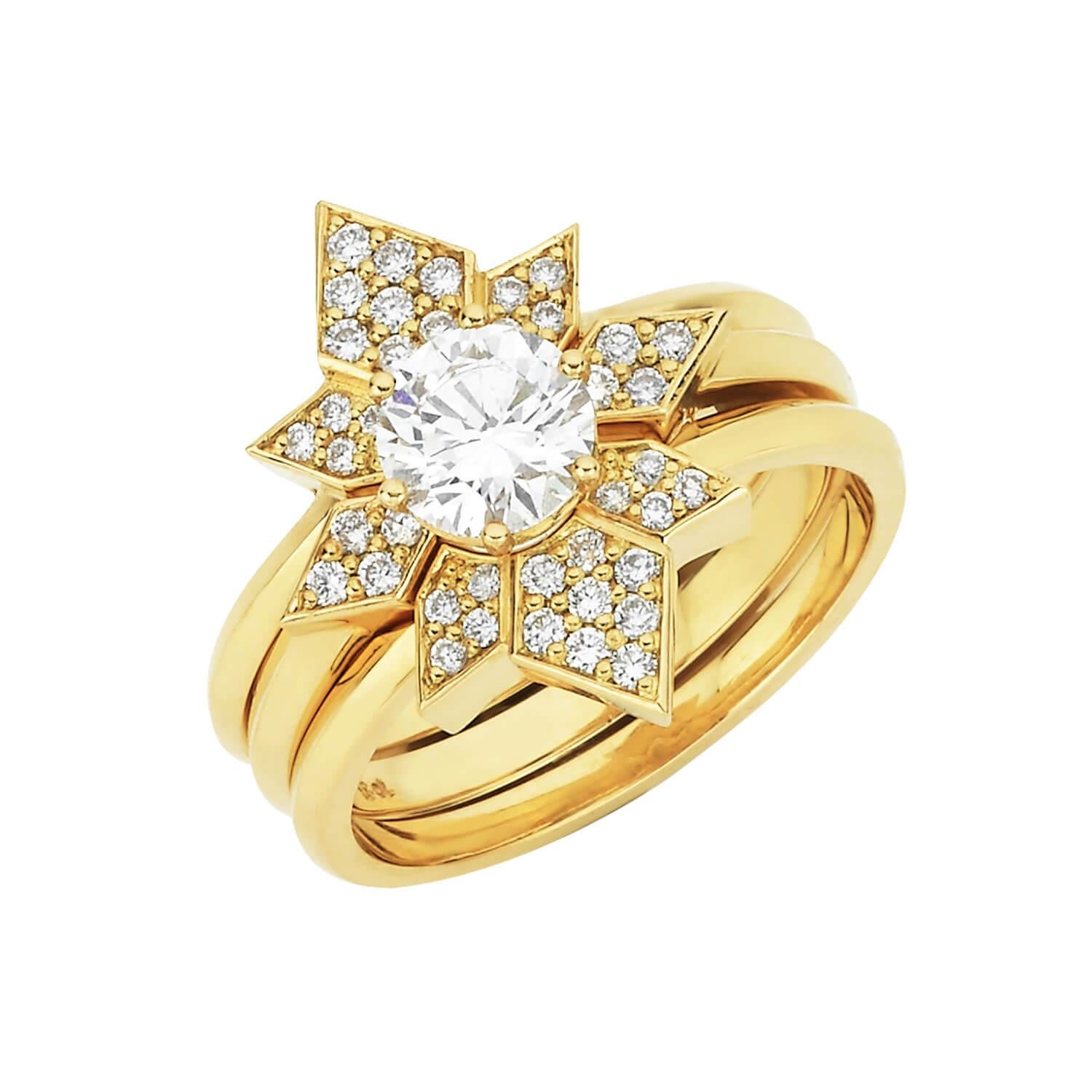 The Dahlia and Amara Ring Set is a symbol of the spark of love. 
The wedding bands create a radiant geometrical shape with the solitaire diamond shining brightly from within. 

18k yellow gold engagement ring, with a centre diamond of 0.65ct, Round