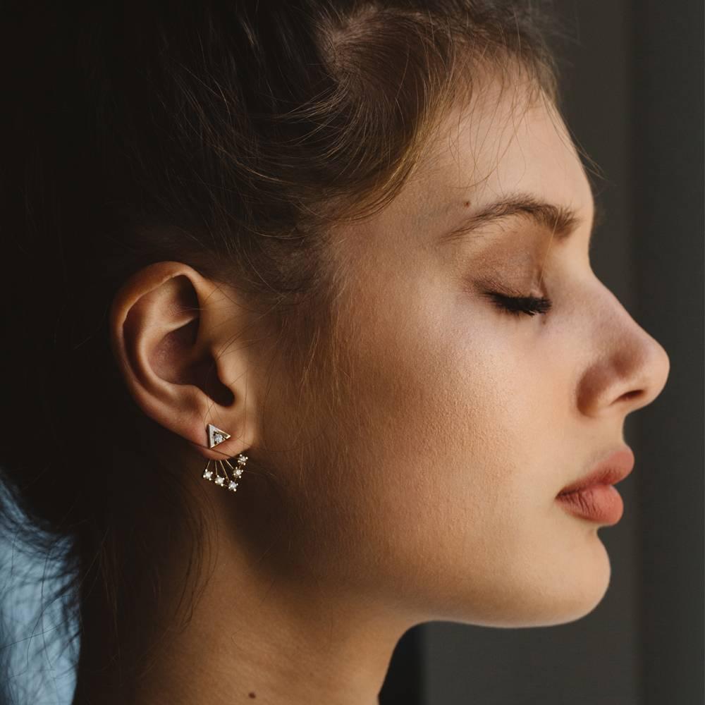 Shine bright. Shine on!

9k white gold ear jacket style earrings set with 6 diamonds in each earring.

These two-part earrings feature a simple stud set with a diamond, as well as a drop-down add-on set with 5 round diamonds.
Wear as studs for a