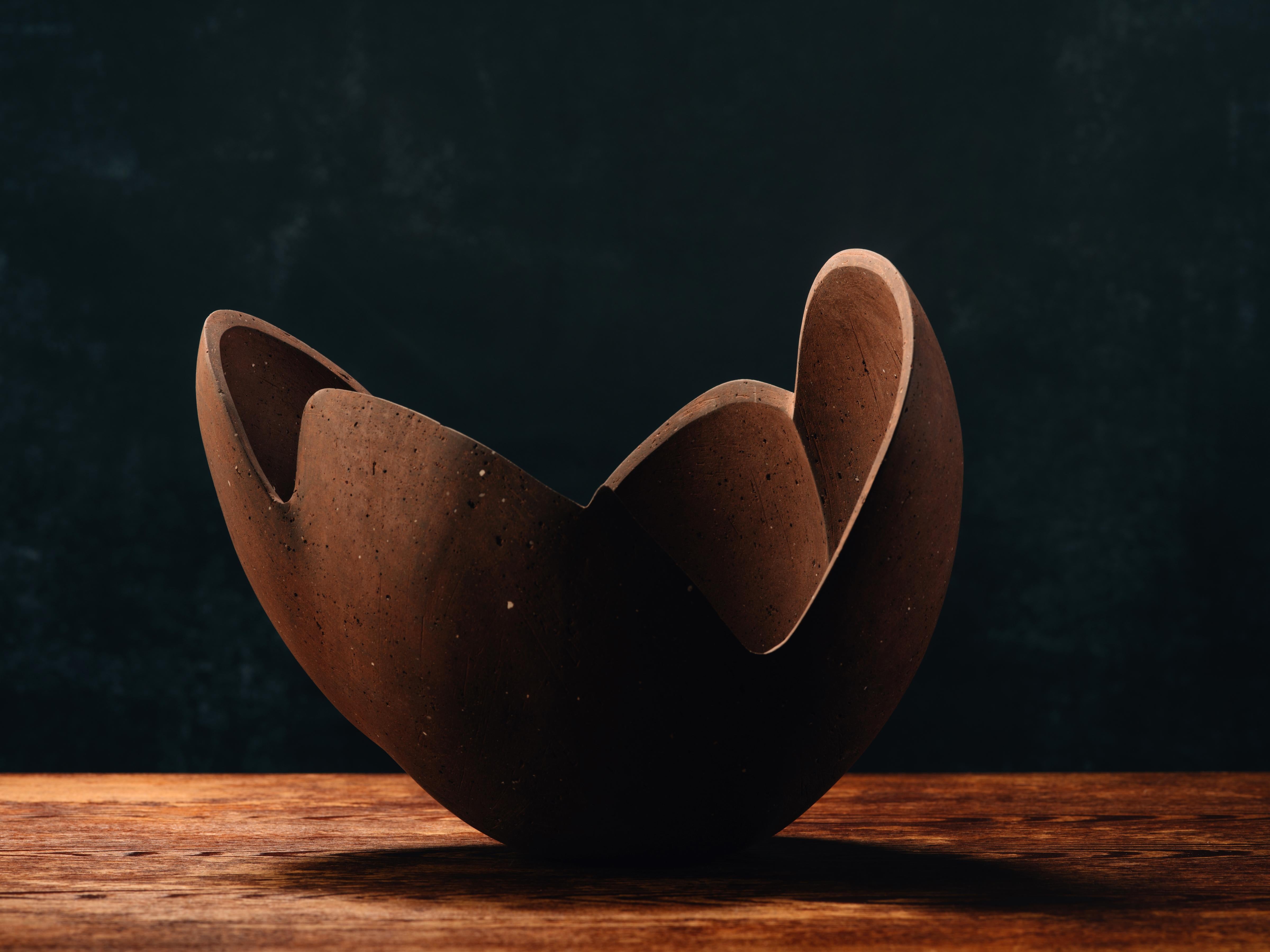 Title: Perianth 06
Year: 2021

Freeform ceramic sculpture made from a blend of high-iron stoneware clays hand-collected by the artist in Minnesota. Its surface is hand-polished with diamond sandpaper to render a matte finish. Signed with the